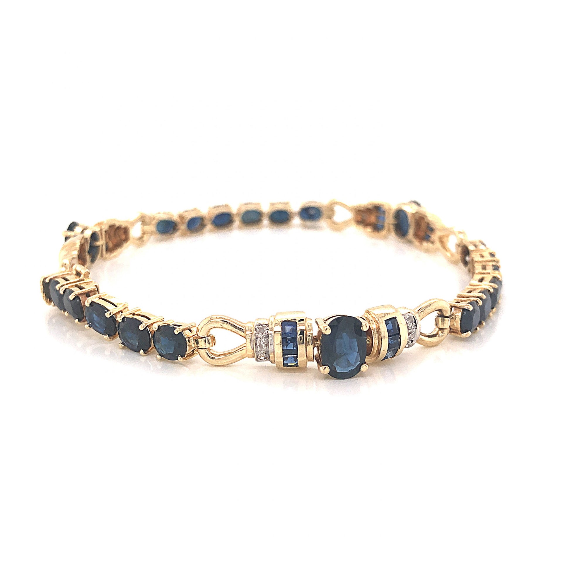 Oval Cut Sapphire Bracelet w/ Diamonds in 14k Yellow GoldComposition: 14 Karat Yellow GoldTotal Diamond Weight: .09 ctTotal Gram Weight: 12.7 gInscription: 585