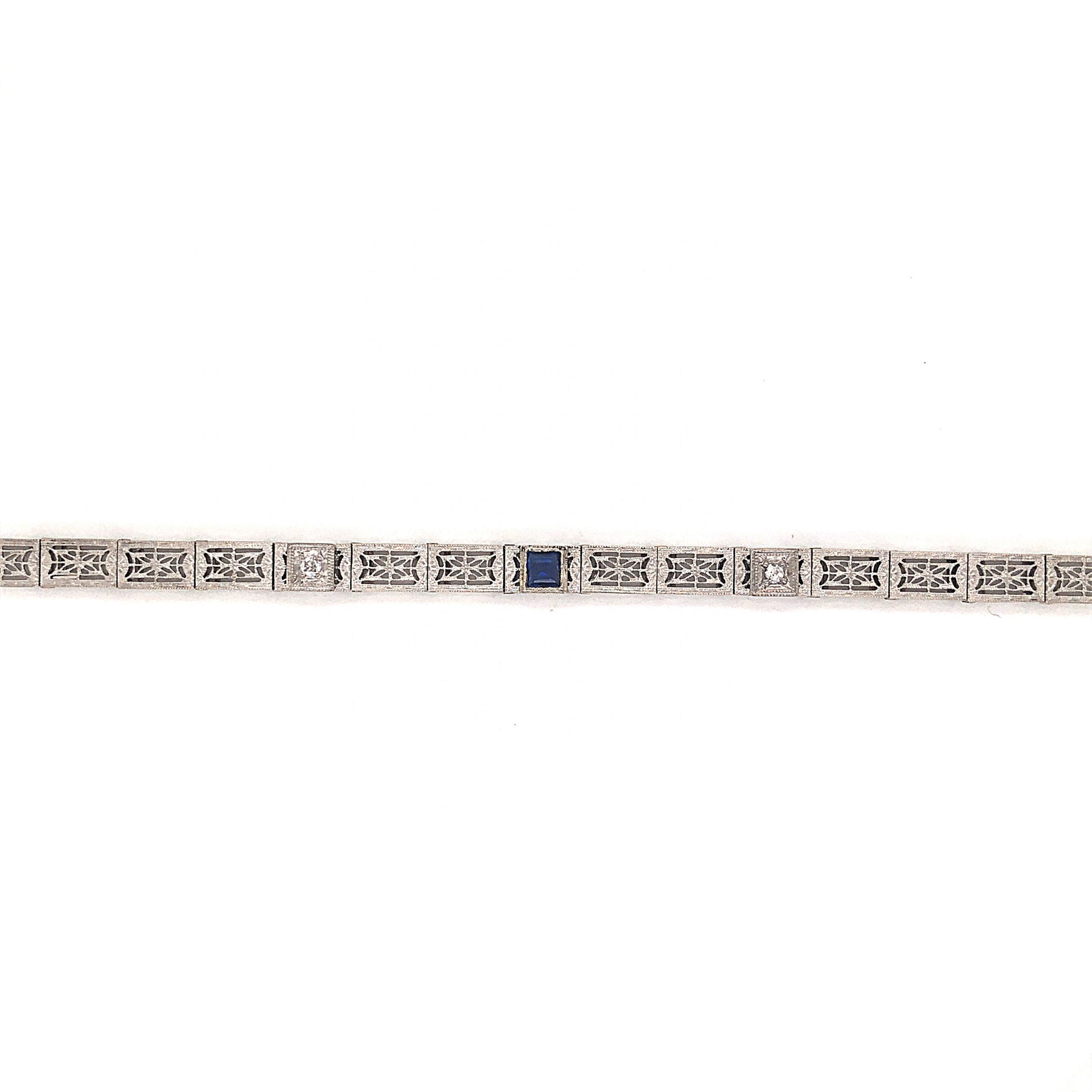 Art Deco Filigree Link Bracelet in 14k White GoldComposition: 14 Karat White GoldTotal Diamond Weight: .08 ctTotal Gram Weight: 7.1 gInscription: 14k