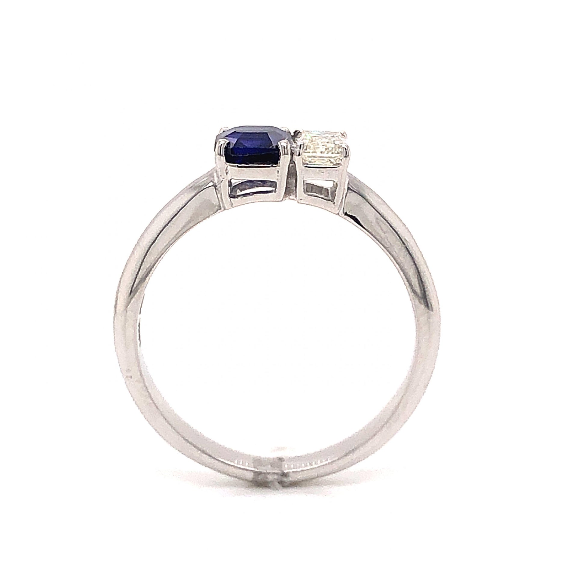 Two Stone Sapphire & Diamond Ring in 18k White GoldComposition: 18 Karat White Gold Ring Size: 6.75 Total Diamond Weight: .31ct Total Gram Weight: 3.8 g Inscription: 18k
      