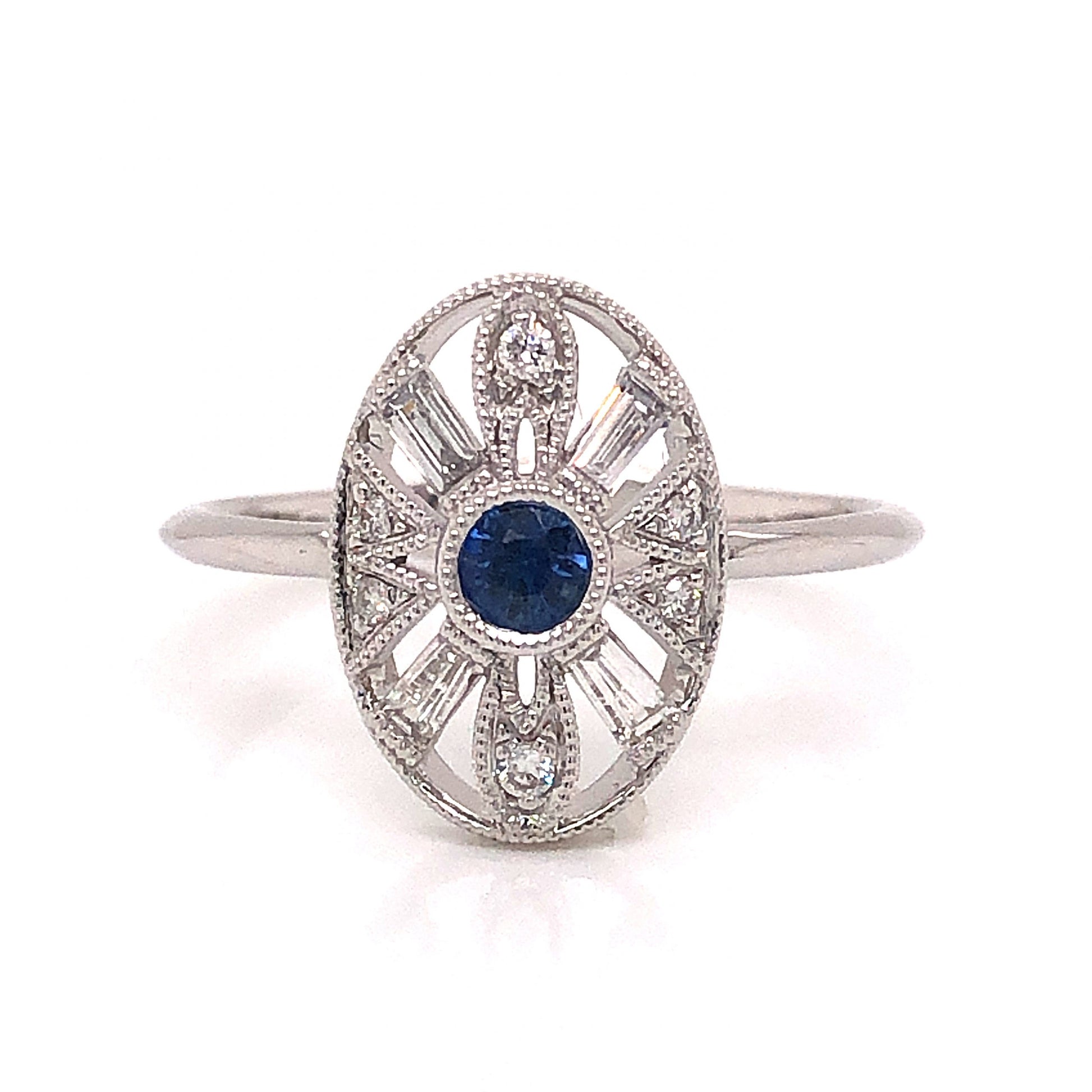 Art Deco Inspired Sapphire & Diamond Ring in 18k White GoldComposition: 18 Karat White Gold Ring Size: 6.5 Total Diamond Weight: .19ct Total Gram Weight: 2.58 g Inscription: 18k
      