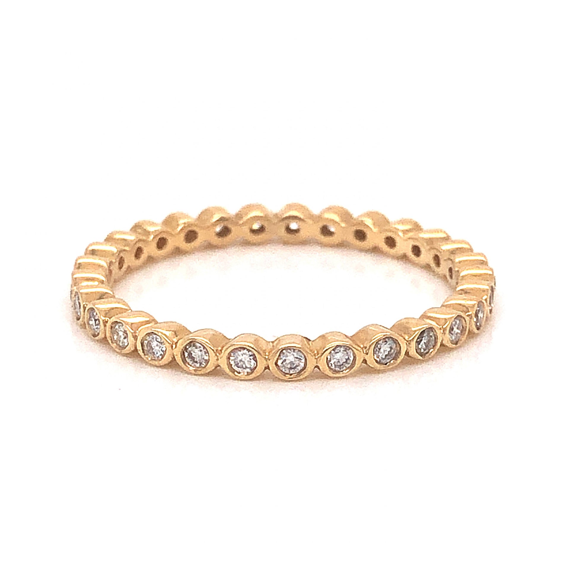 Bezel Set Eternity Diamond Band in 14k Yellow GoldComposition: 14 Karat Yellow Gold Ring Size: 6.5 Total Diamond Weight: .32ct Total Gram Weight: 1.6 g Inscription: 14k .32 ct
      