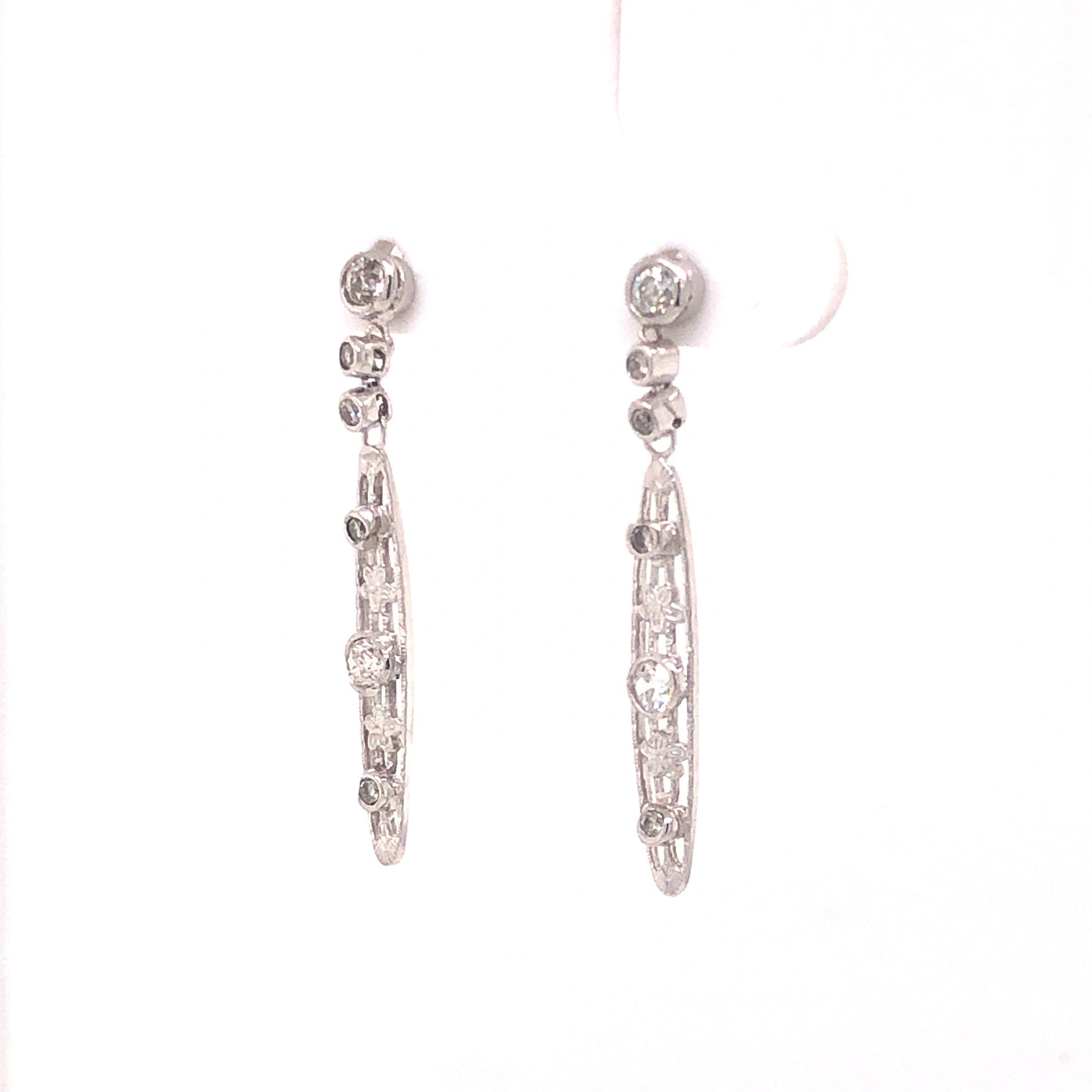 .60 Art Deco Filigree Diamond Drop Earrings in PlatinumComposition: Platinum Total Diamond Weight: .60ct Total Gram Weight: 2.3 g