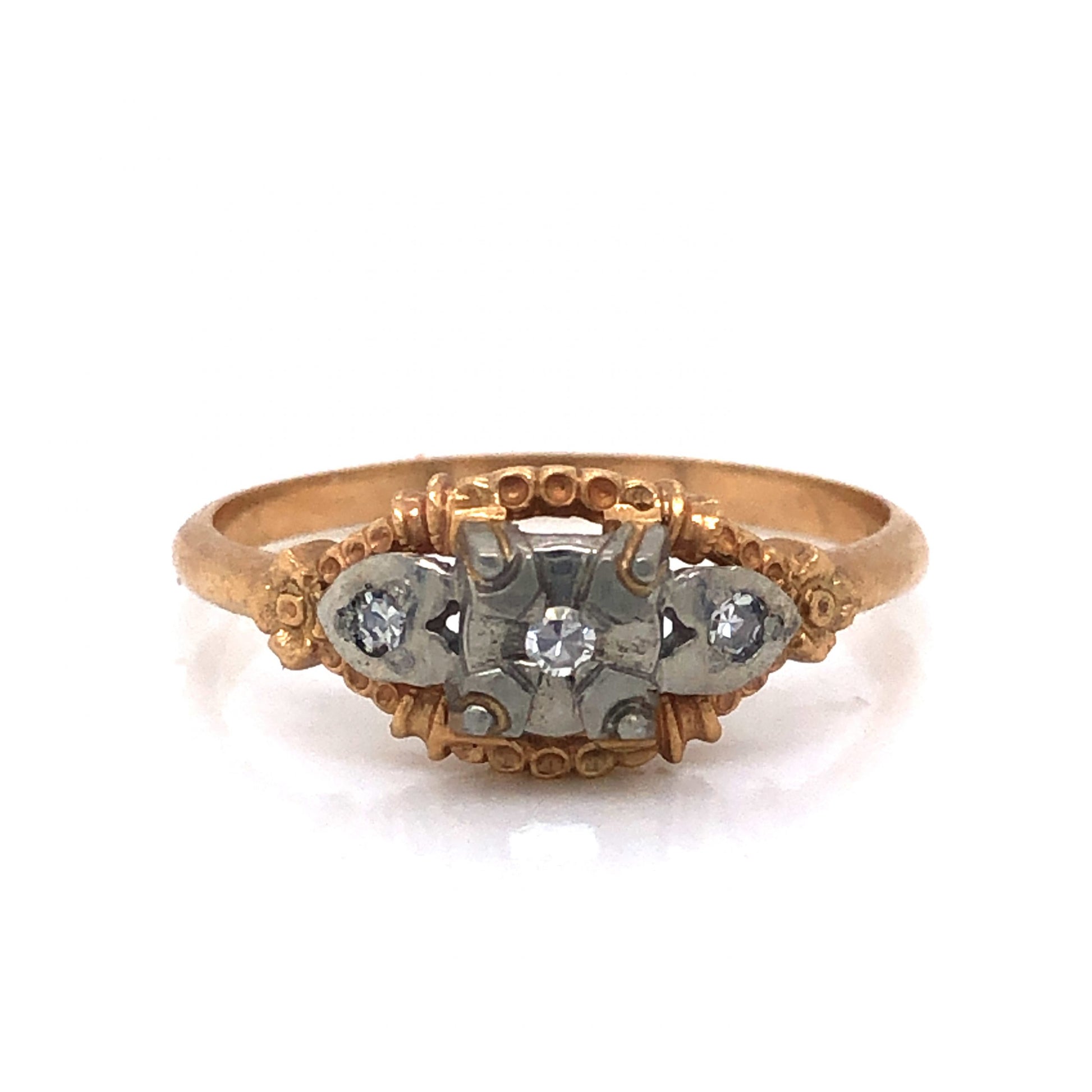 Petite Three Stone Diamond Engagement Ring in 14k & 18k GoldComposition: 14 Karat Yellow Gold/18 Karat White Gold Ring Size: 6.25 Total Diamond Weight: .045ct Total Gram Weight: 1.9 g Inscription: 14-18k
      