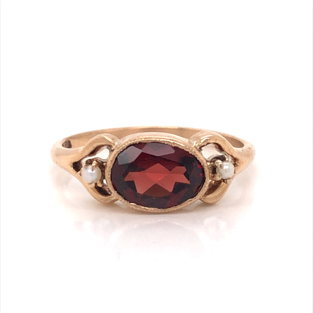 Victorian Garnet & Pearl Ring in 10k Yellow GoldComposition: 10 Karat Yellow Gold Ring Size: 6 Total Gram Weight: 2.1 g