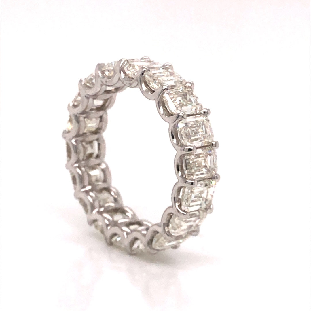 Emerald Cut Diamond Eternity Band in 18k White GoldComposition: 18 Karat White GoldRing Size: 6Total Diamond Weight: 7.21 ctTotal Gram Weight: 4.5 g