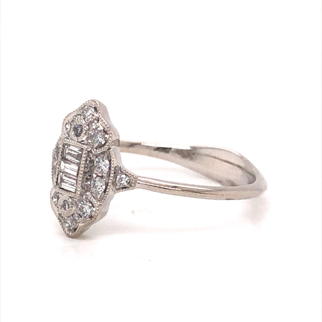 Antique Inspired Diamond Cluster Ring in 18k White GoldComposition: 18 Karat White GoldRing Size: 6.5Total Diamond Weight: .26 ctTotal Gram Weight: 2.4 gInscription: JHK 18k 750