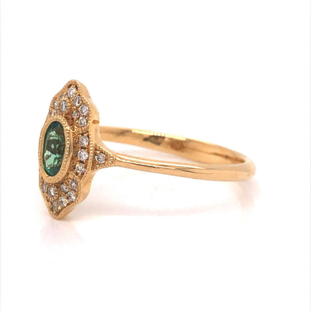 Antique Inspired Oval Emerald & Diamond Ring in 18k Yellow GoldComposition: 18 Karat Yellow GoldRing Size: 6.5Total Diamond Weight: .11 ctTotal Gram Weight: 2.1 gInscription: JHK 18k