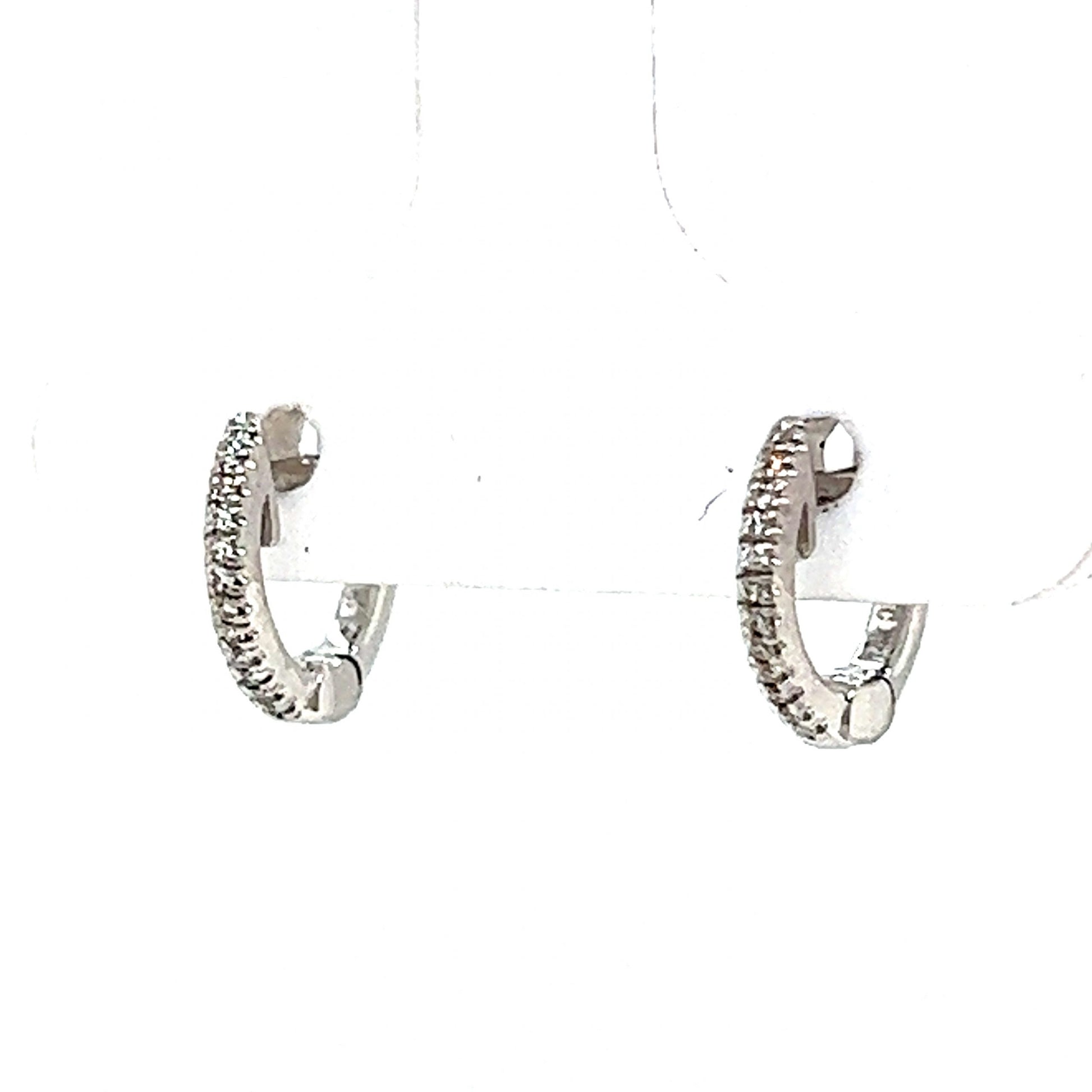 Everyday Diamond Huggie Hoop Earrings in 14k White GoldComposition: 14 Karat White Gold Total Diamond Weight: .11ct Total Gram Weight: 2.5 g Inscription: 14k .11
      