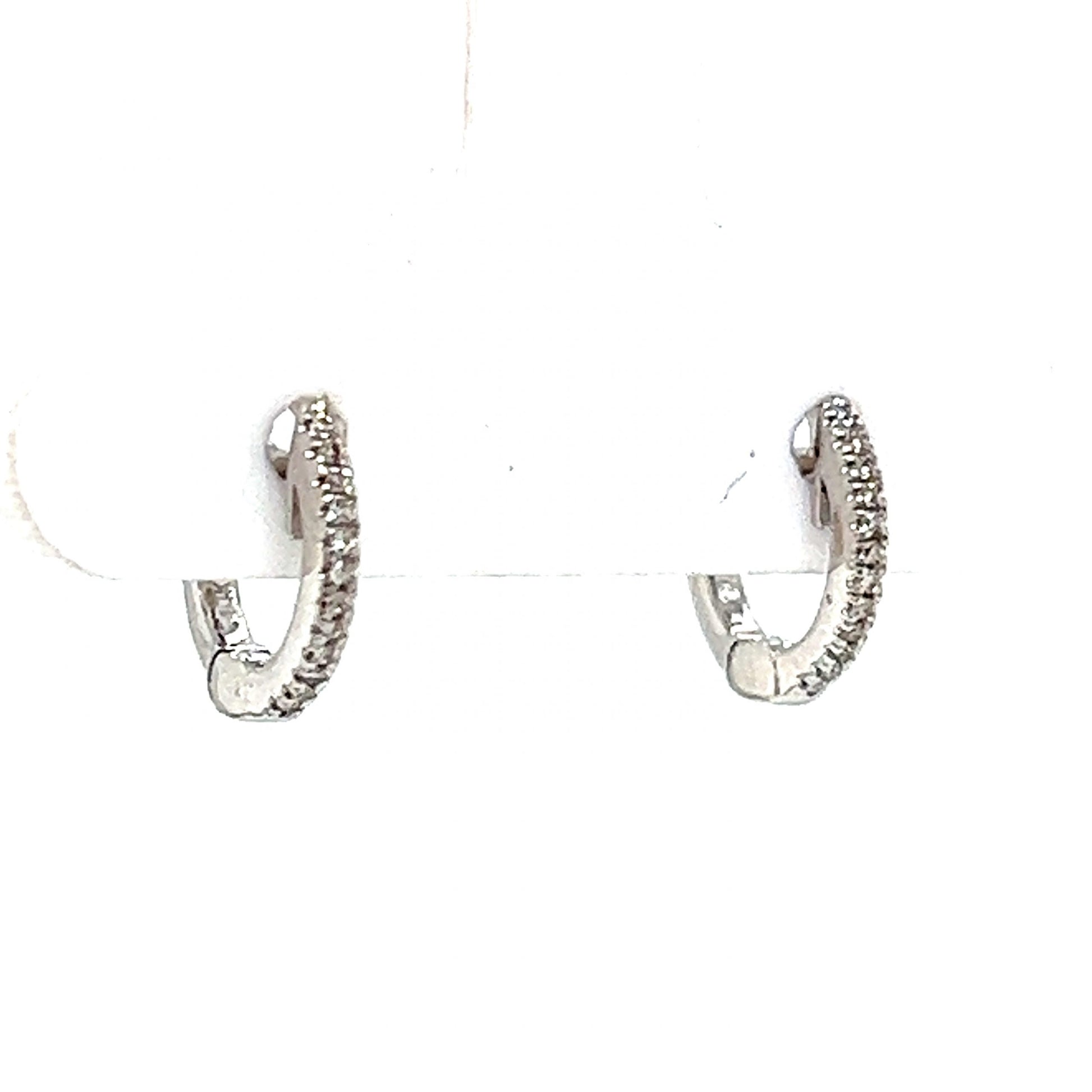 Small Huggie Diamond Hoop Earrings in 14k White GoldComposition: 14 Karat White Gold Total Diamond Weight: .04ct Total Gram Weight: 1.1 g