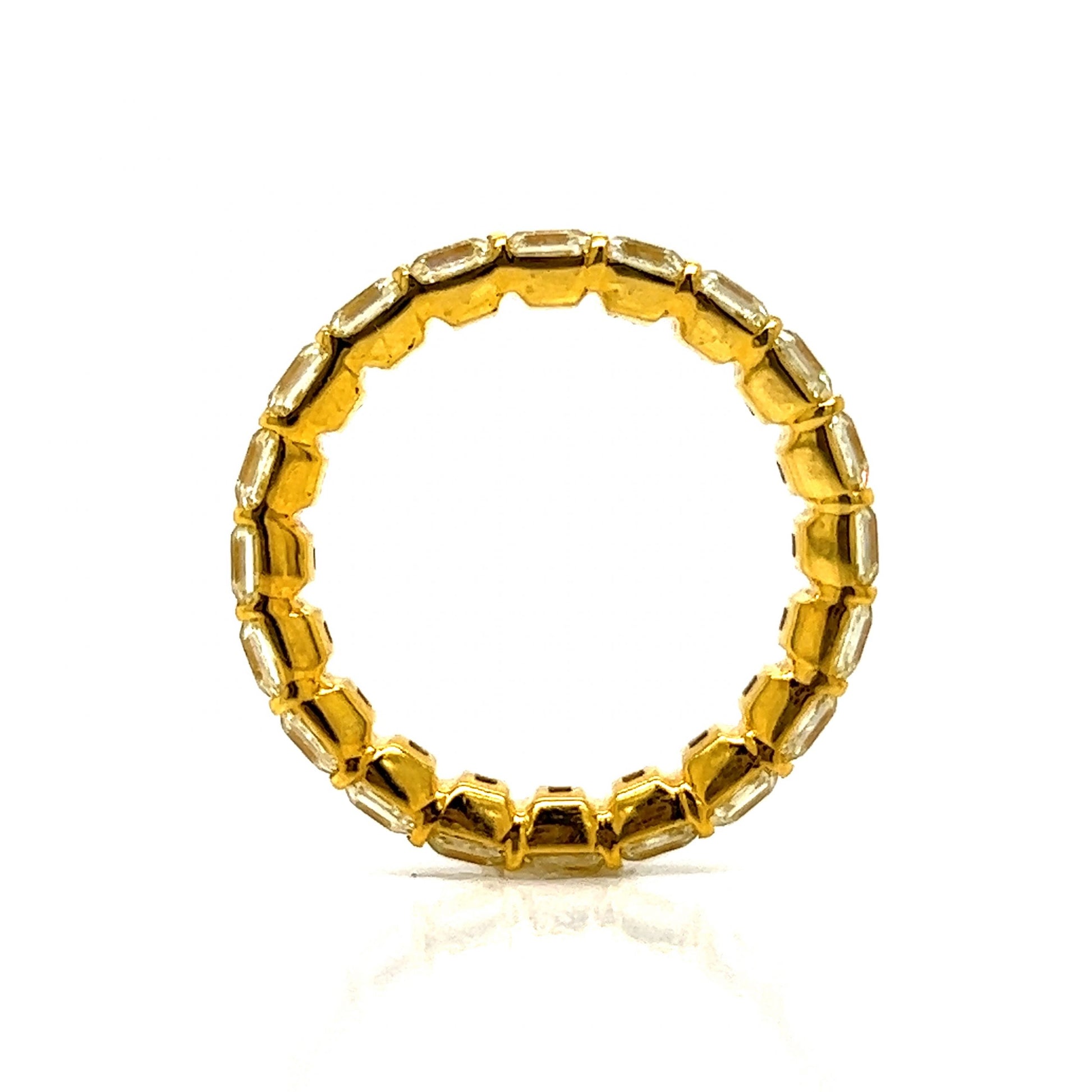 5.56 Fancy Yellow Asscher Cut Diamond Eternity Band in 18kComposition: 18 Karat Yellow Gold Ring Size: 7 Total Diamond Weight: 5.56ct Total Gram Weight: 3.5 g
