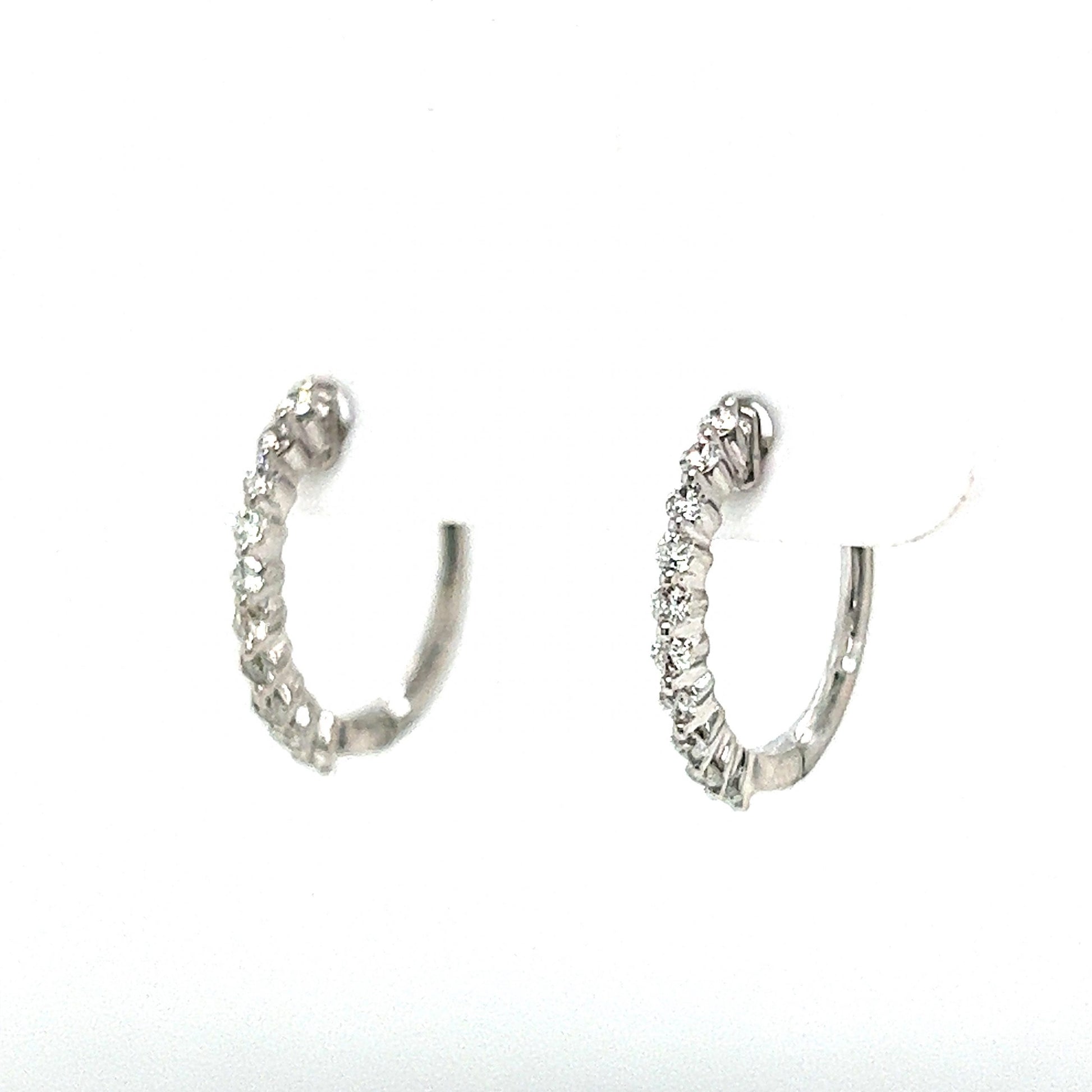 Shared Prong Diamond Hoop Earrings in 14k White GoldComposition: 14 Karat White GoldTotal Diamond Weight: .28 ctTotal Gram Weight: 1.6 gInscription: 14k 