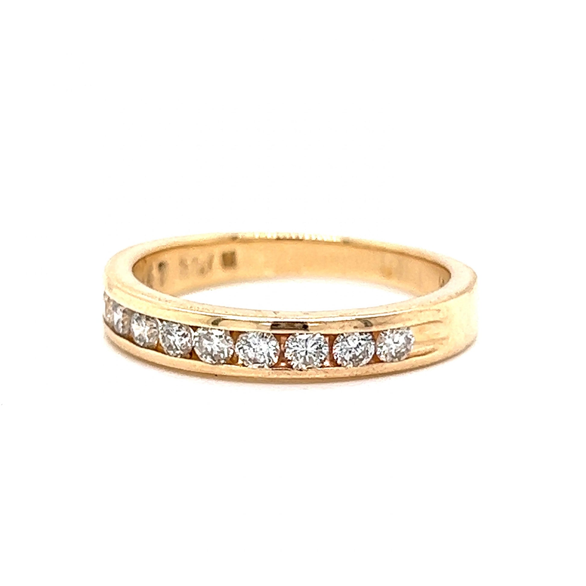 .47 Channel Set Diamond Wedding Band in 14k Yellow GoldComposition: 14 Karat Yellow GoldRing Size: 6.5Total Diamond Weight: .47 ctTotal Gram Weight: 3.3 gInscription: 14k .47 TWN