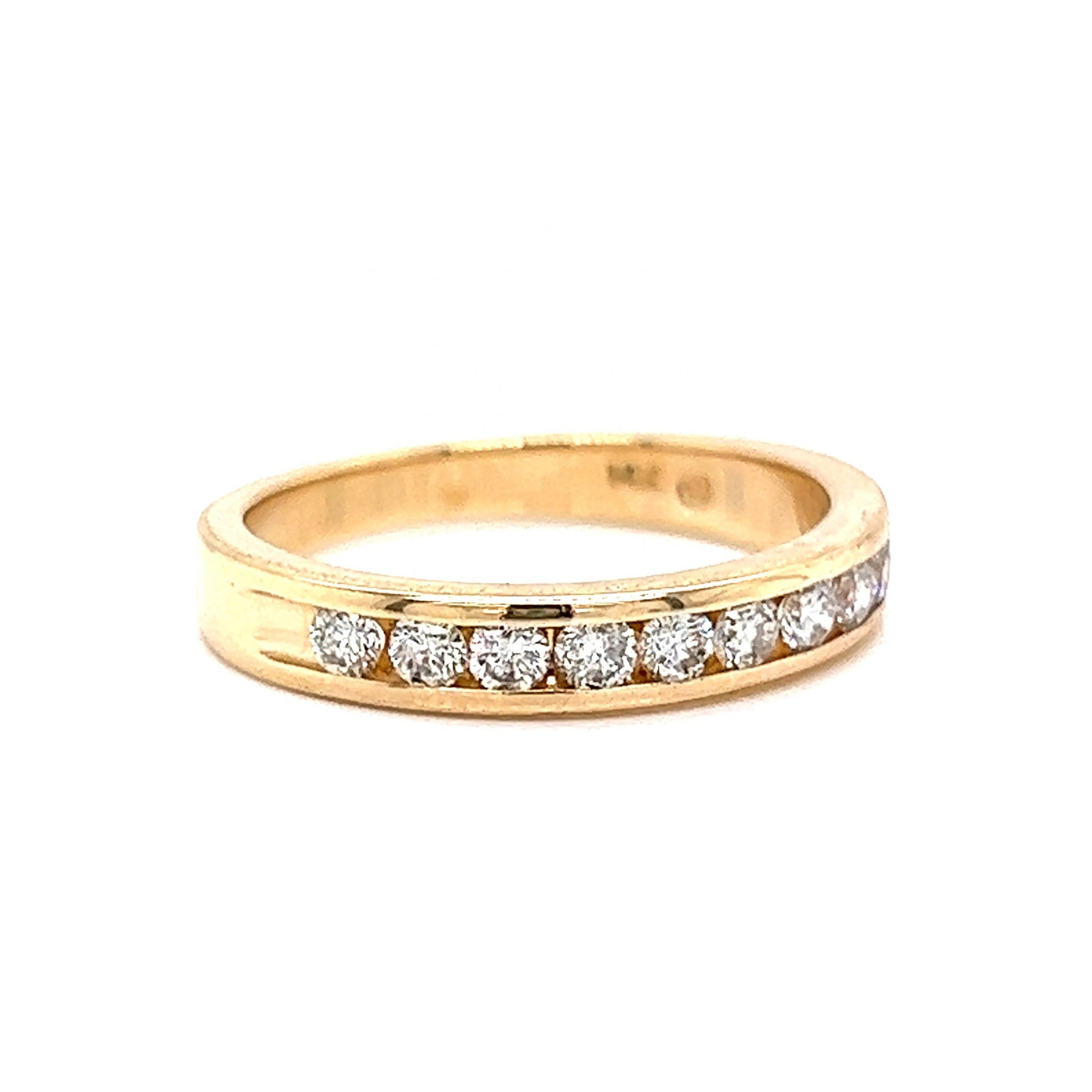.47 Channel Set Diamond Wedding Band in 14k Yellow GoldComposition: 14 Karat Yellow GoldRing Size: 6.5Total Diamond Weight: .47 ctTotal Gram Weight: 3.3 gInscription: 14k .47 TWN