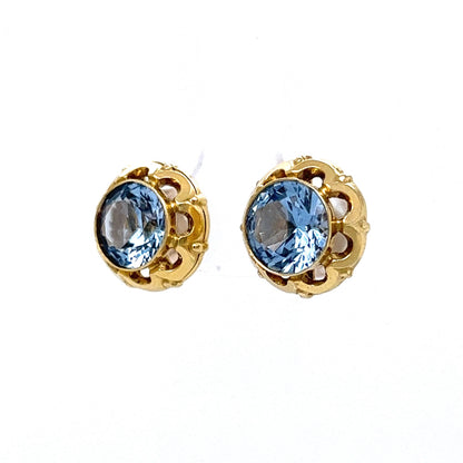 Bezel Set Blue Zircon Stud Earrings in 14k Yellow Gold