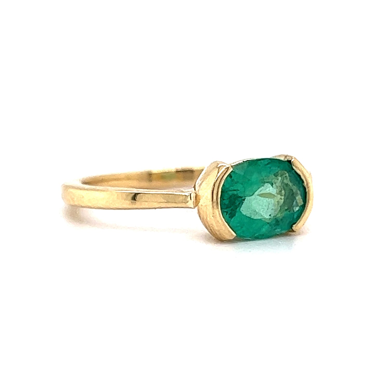 Half Bezel Set Oval Cut Emerald Ring in 14k Yellow Gold