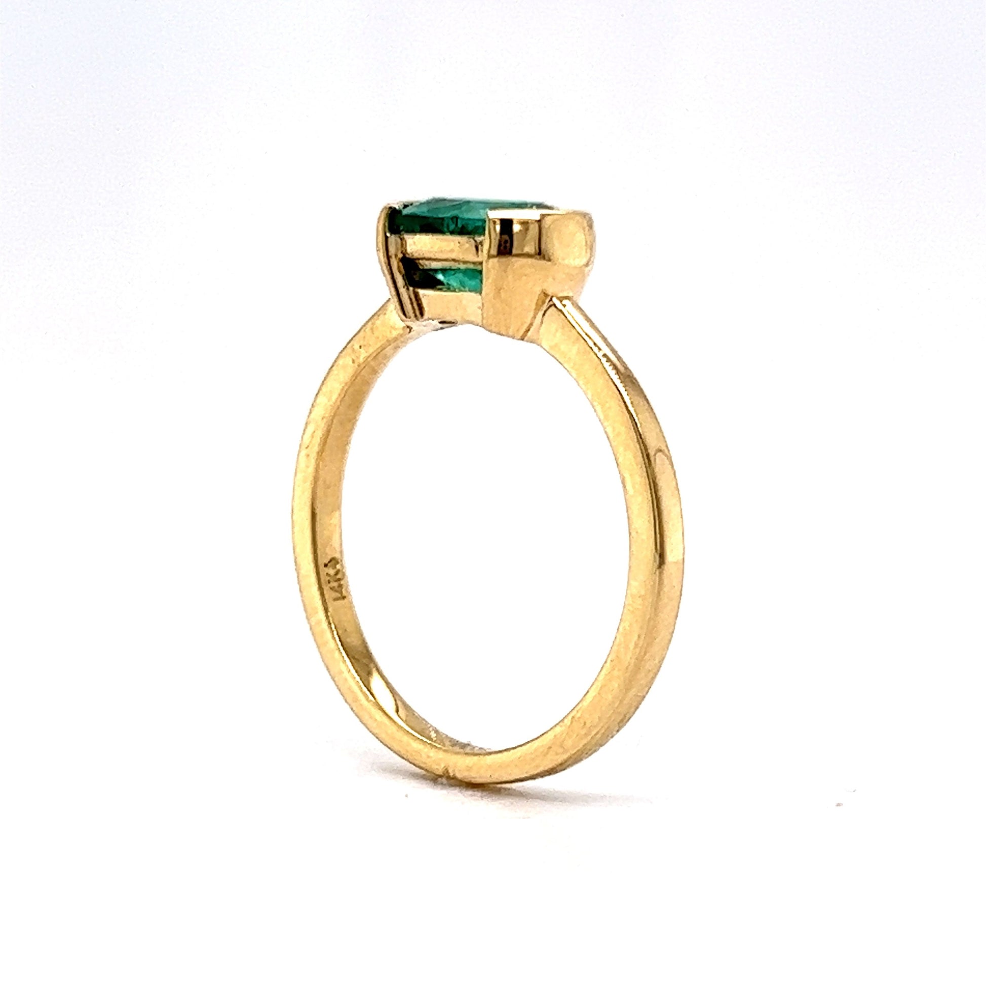 Half Bezel Set Oval Cut Emerald Ring in 14k Yellow Gold