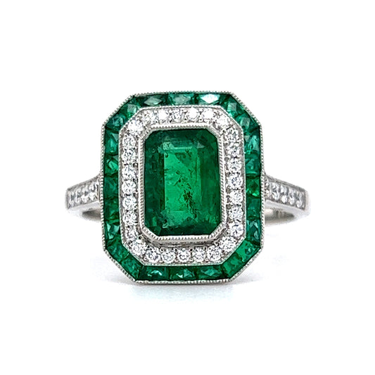 Bezel Set Emerald & Diamond Halo Cocktail Ring in Platinum