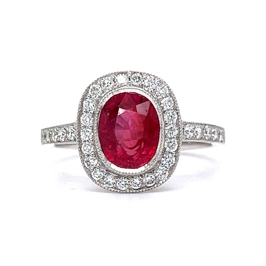 Oval Cut Red Sapphire & Diamond Halo Ring in Platinum