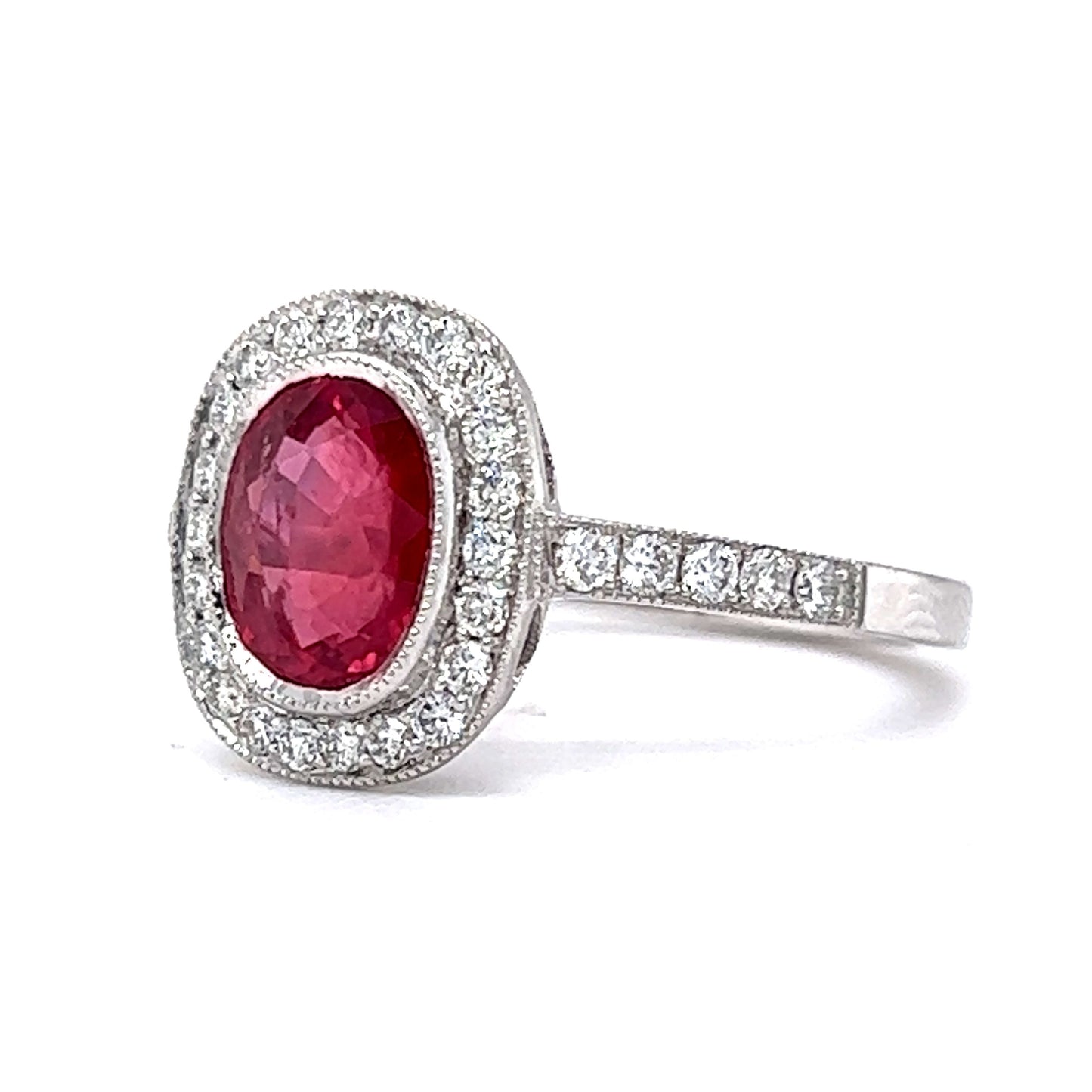 Oval Cut Red Sapphire & Diamond Halo Ring in Platinum