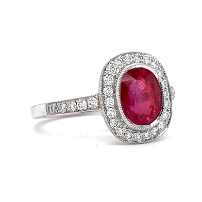 Oval Cut Red Sapphire & Diamond Halo Ring in Platinum