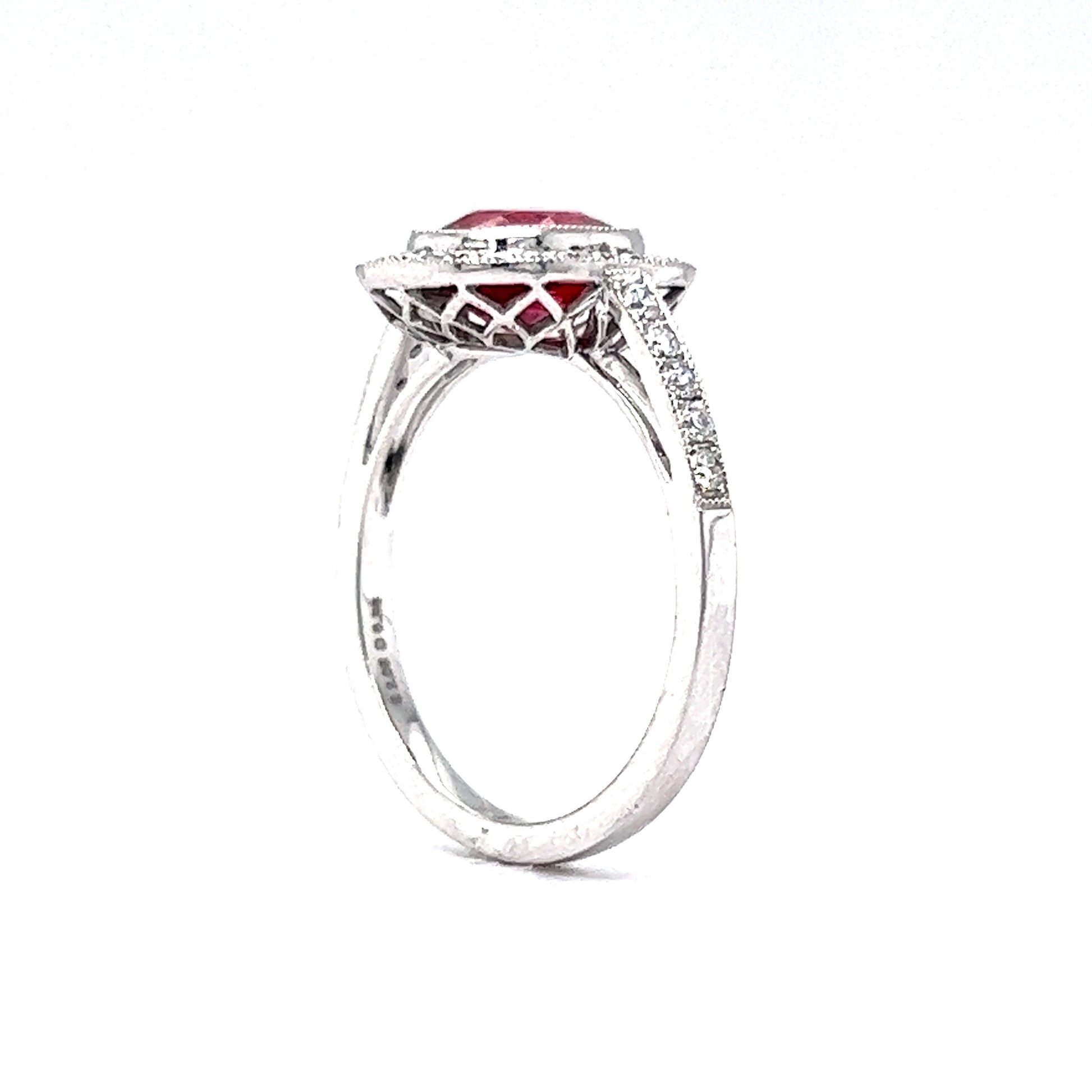 Oval Cut Red Sapphire & Diamond Halo Ring in Platinum