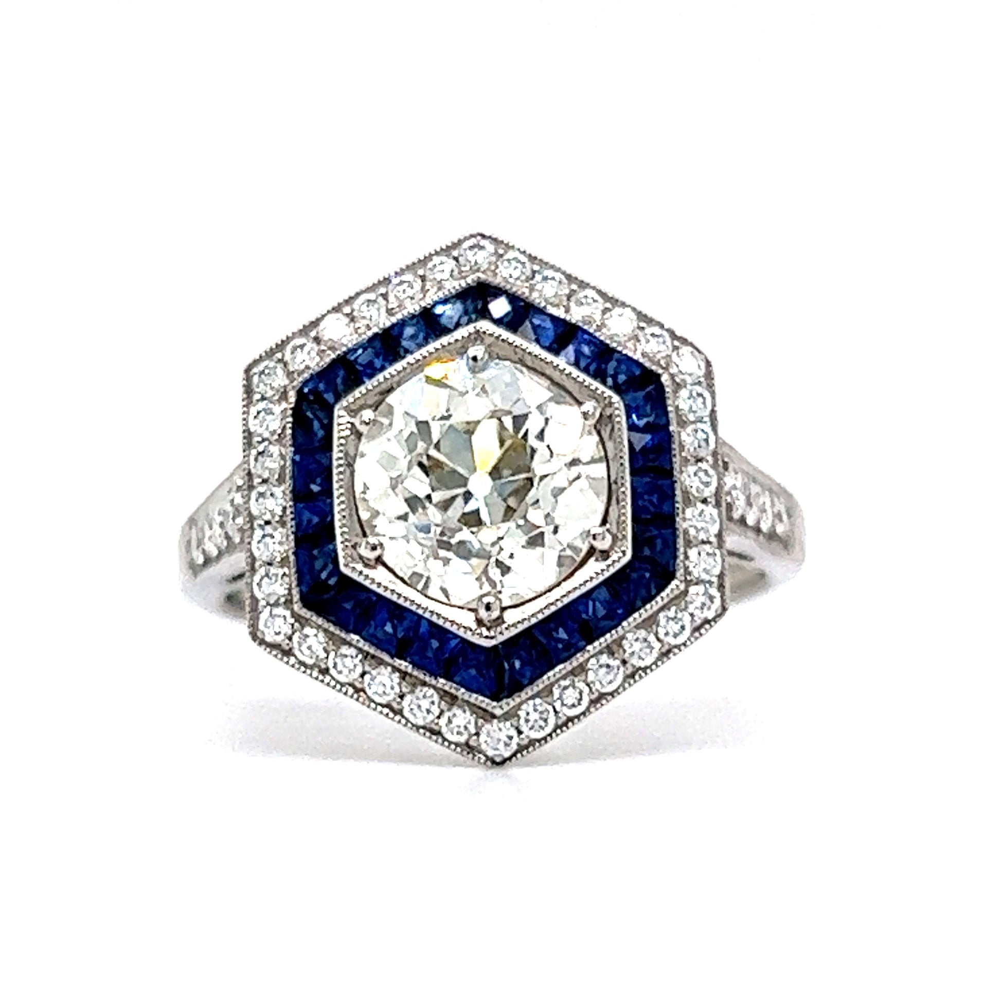 1.51 Hexagon Shaped Diamond & Sapphire Engagement Ring in PlatinumComposition: Platinum Ring Size: 6.5 Total Diamond Weight: 1.81ct Total Gram Weight: 6.3 g Inscription: Pt950 Sophia D.
      