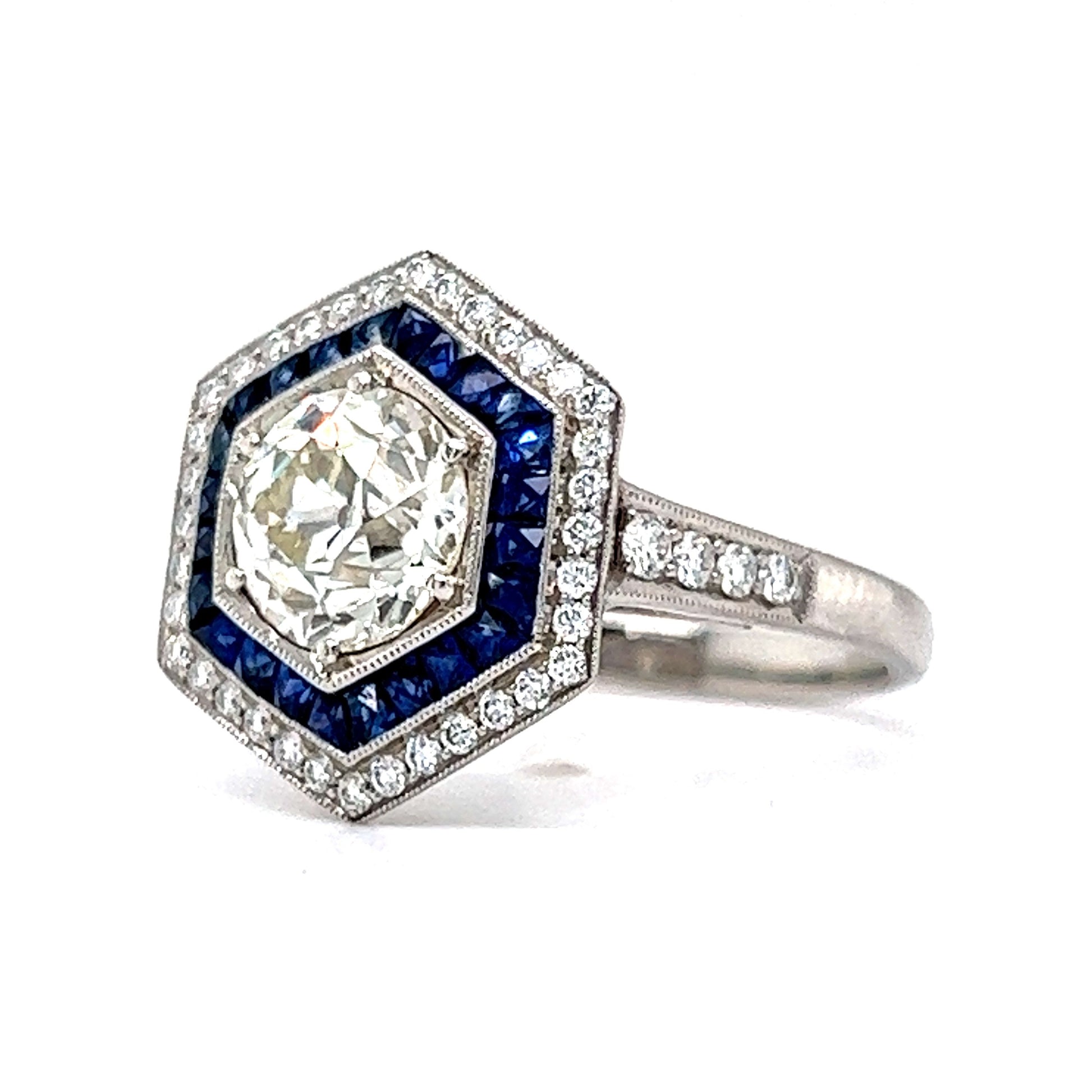 1.51 Hexagon Shaped Diamond & Sapphire Engagement Ring in PlatinumComposition: Platinum Ring Size: 6.5 Total Diamond Weight: 1.81ct Total Gram Weight: 6.3 g Inscription: Pt950 Sophia D.
      