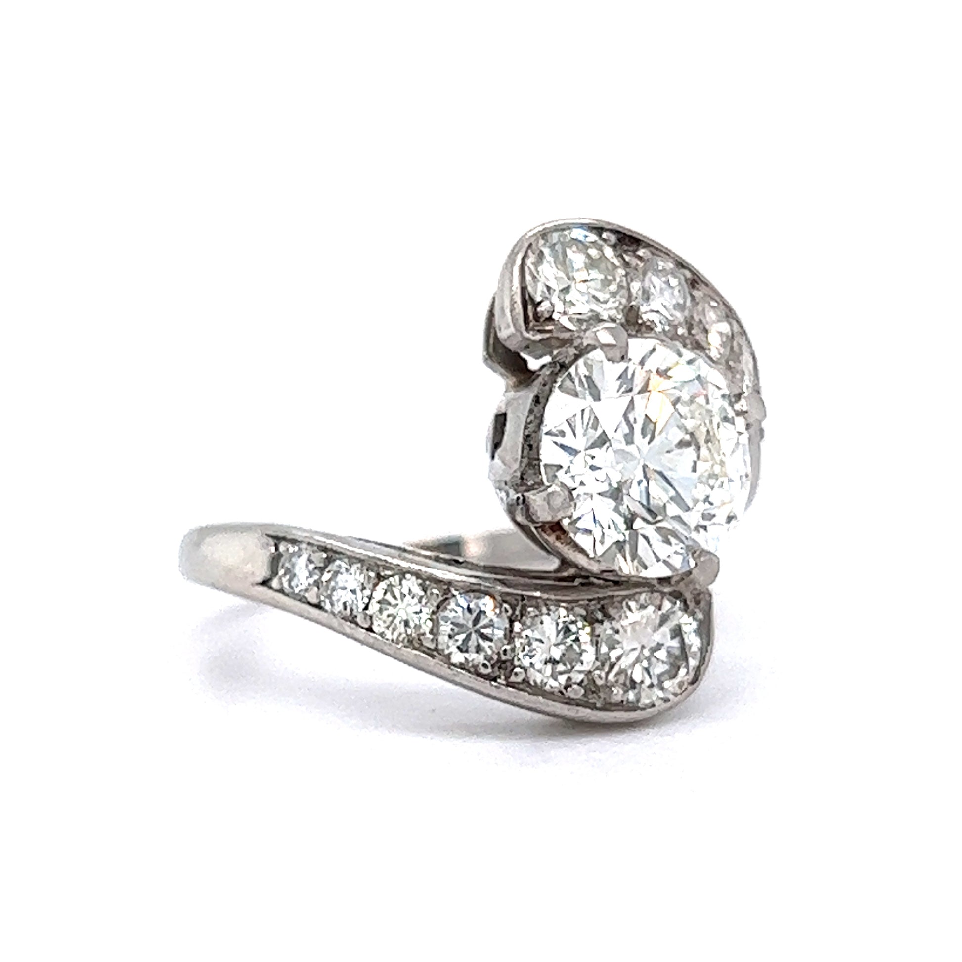 Mid-Century Bypass Diamond Engagement Ring in PlatinumComposition: Platinum Ring Size: 7 Total Diamond Weight: 3.01ct Total Gram Weight: 8.2 g Inscription: 10%
      