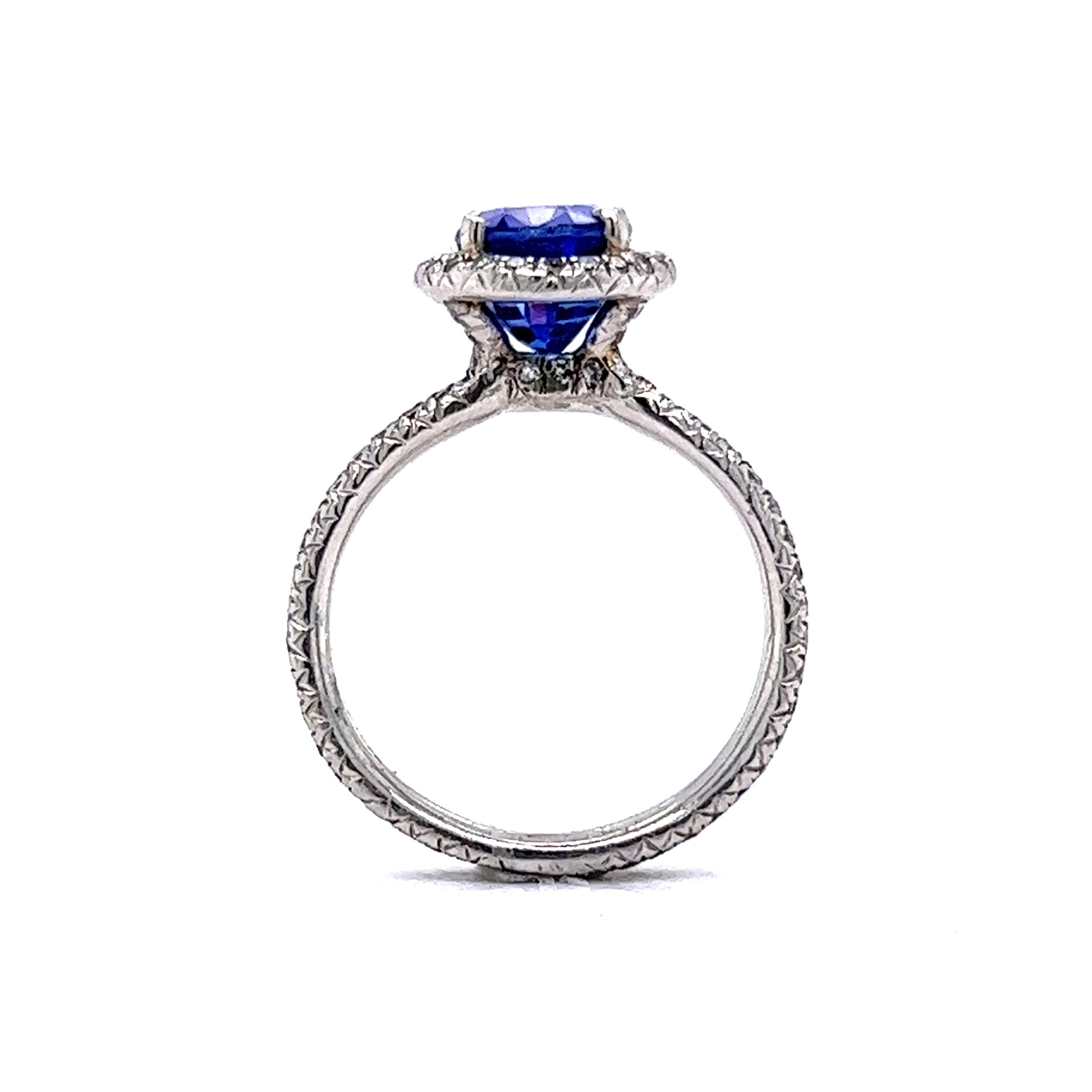 Oval Cut Tanzanite & Diamond Halo Ring in PlatinumComposition: PlatinumTotal Diamond Weight: .59 cttw ctTotal Gram Weight: 6.1 gInscription: FABRIKANT PT950