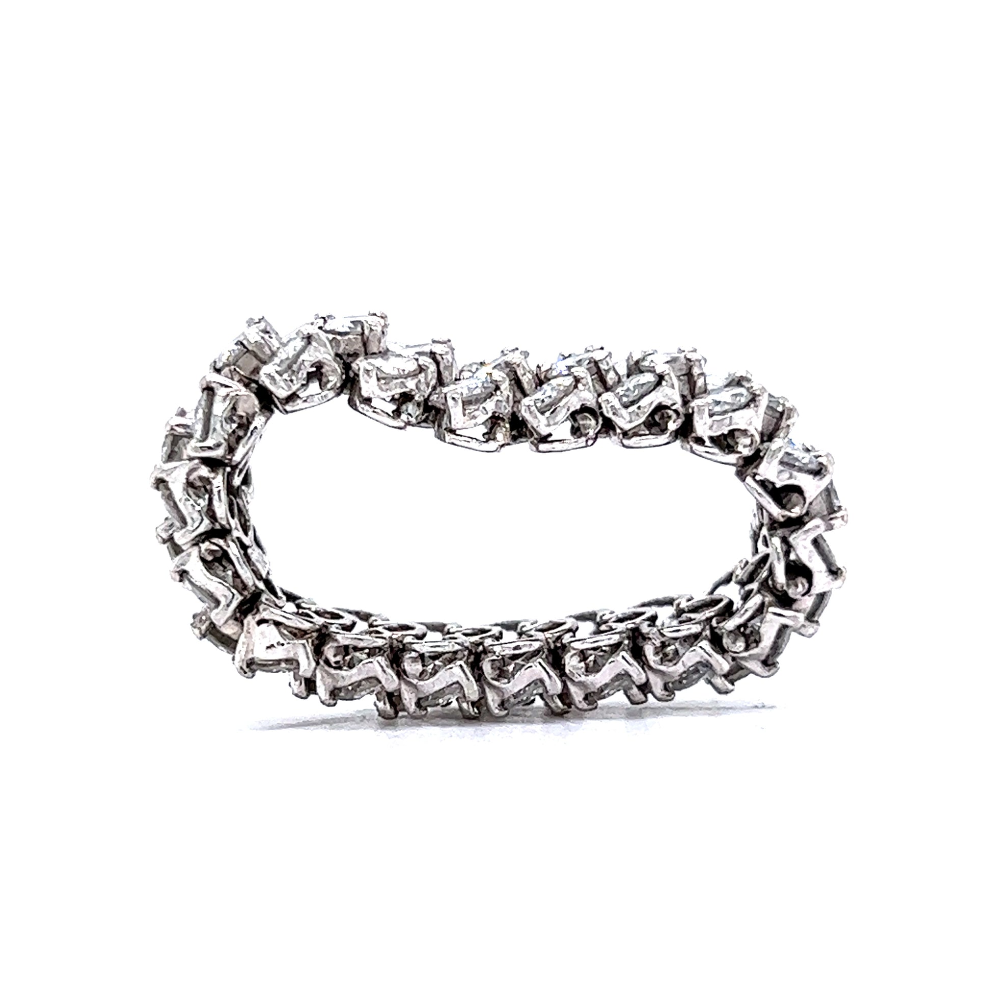 Flexible Diamond Eternity Band in PlatinumComposition: PlatinumRing Size: 7.5Total Diamond Weight: 5.60 ctTotal Gram Weight: 11.20 gInscription: 566