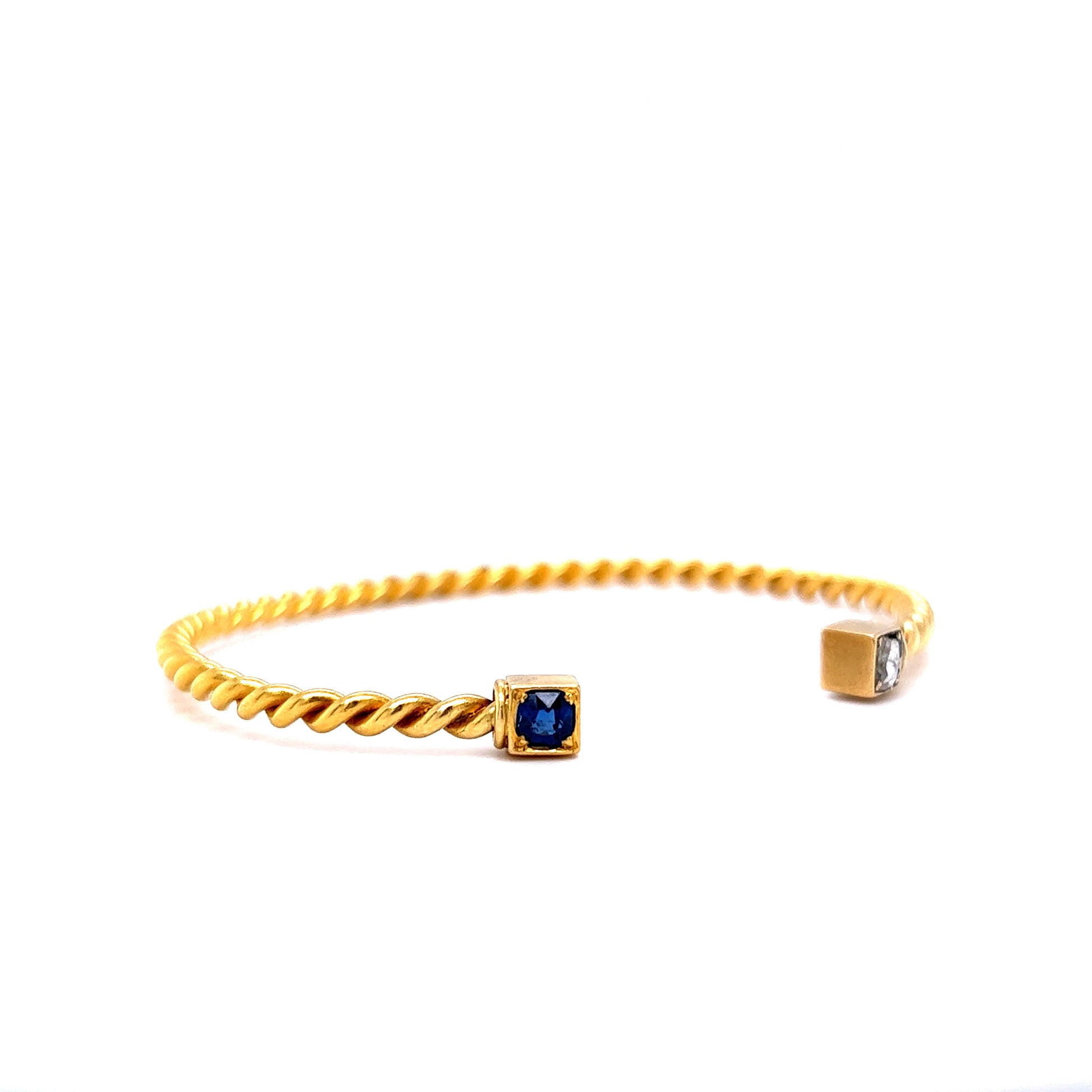 Victorian Diamond & Sapphire Twist Bangle Bracelet in 18k Yellow GoldComposition: 18 Karat Yellow GoldTotal Diamond Weight: .14 ctTotal Gram Weight: 14.9 g
