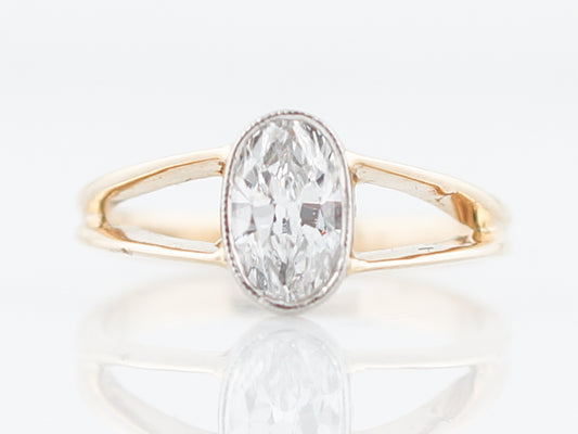 Engagement Ring Modern .63 Oval Cut Diamond in 14K Yellow Gold & Platinum