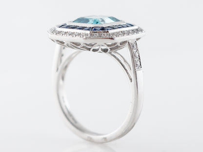 Blue Zircon Ring with Sapphire & Diamond Halo