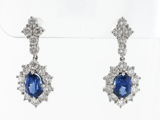 Oval Cut Sapphire & Diamond Drop Earrings in White Gold