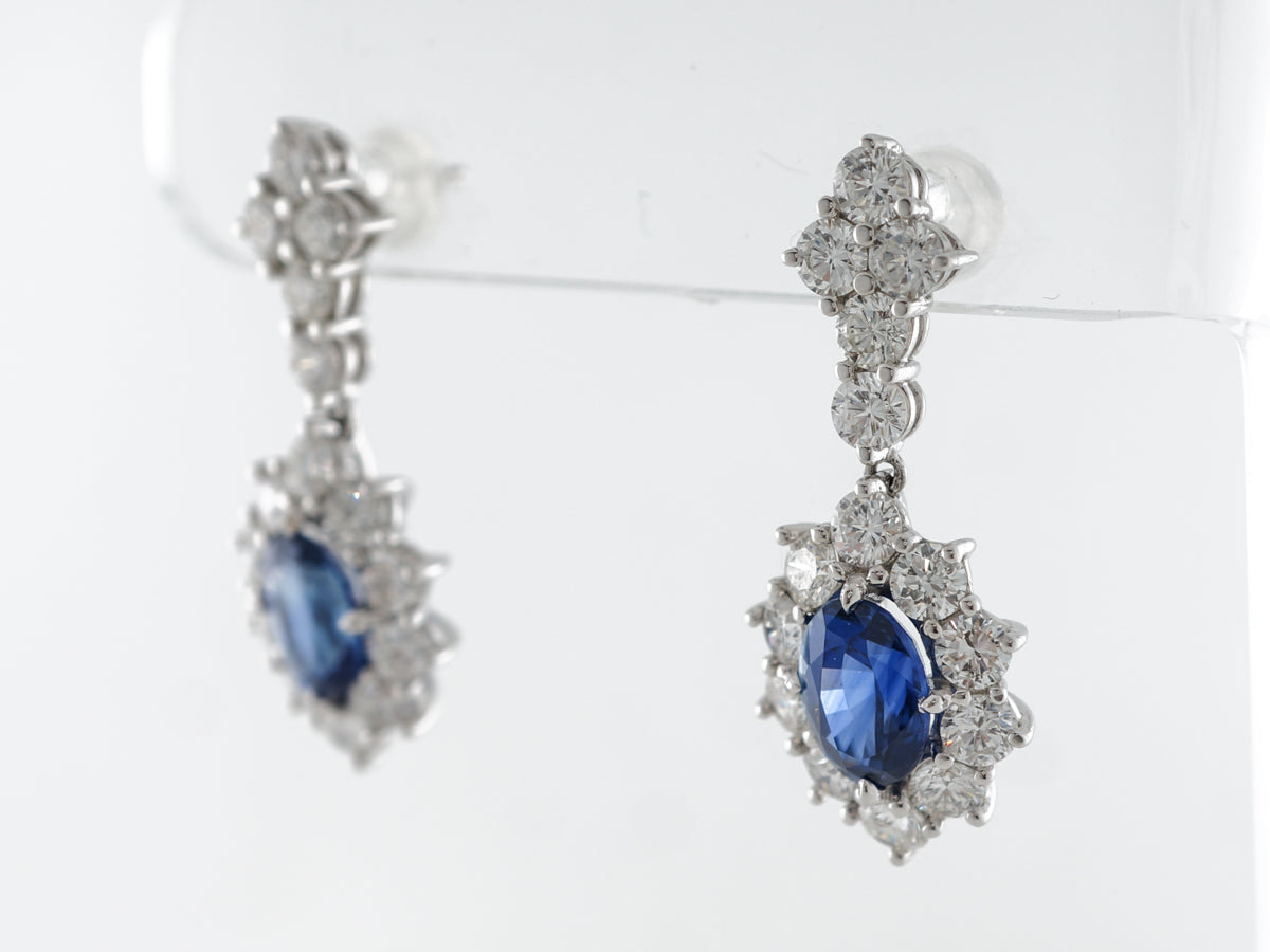 Oval Cut Sapphire & Diamond Drop Earrings in White Gold