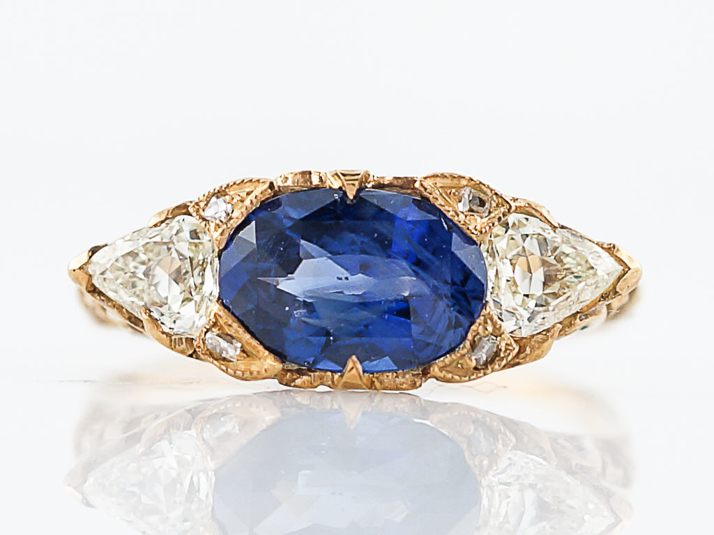 Modern Right Hand Ring 2.21 Oval Cut Sapphire & .53 Pear Cut Diamonds in 18K Yellow GoldComposition: Platinum Ring Size: 6.25 Total Diamond Weight: .53 cttwct Total Gram Weight: 2.73 rams g