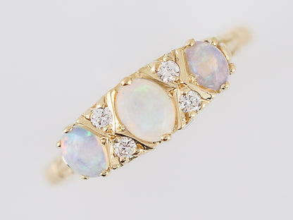 Antique Right Hand Ring Victorian .35 Oval Cabochon Cut Opal & .04 Round Brilliant Cut Diamonds in 18k Yellow Gold