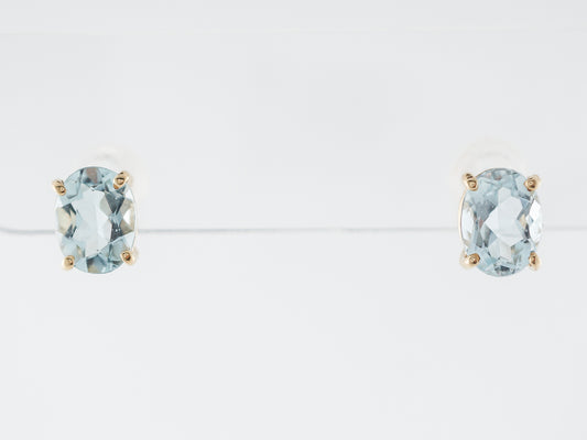 Oval Aquamarine Stud Earrings in 14k Yellow Gold