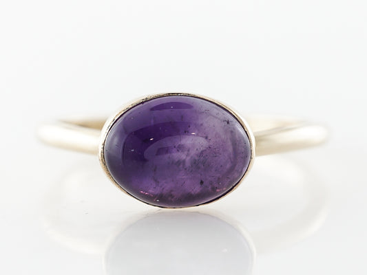 Cabochon Cut Amethyst in Yellow Gold Bezel