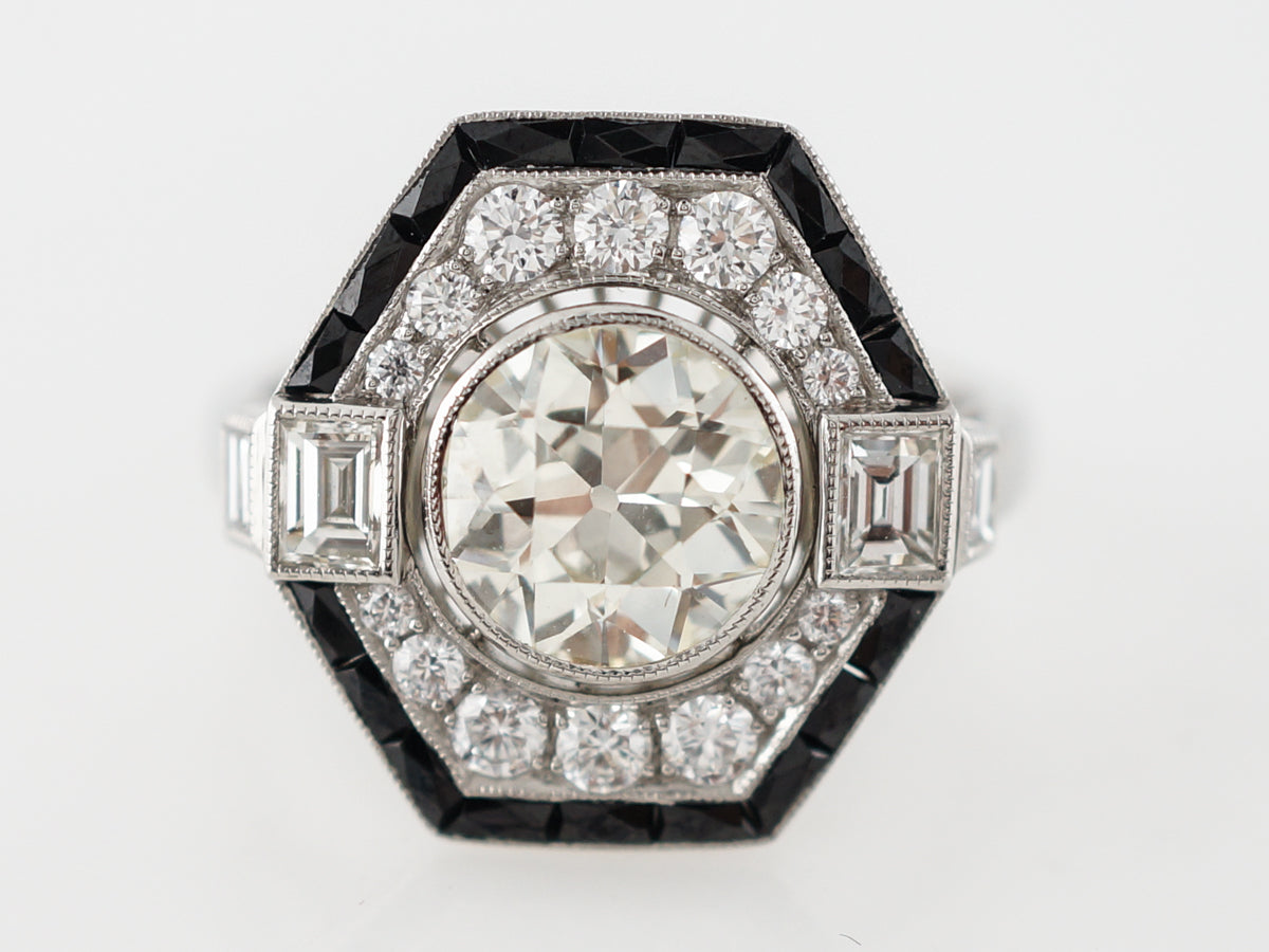 Diamond & Onyx Halo Engagement Ring in Platinum