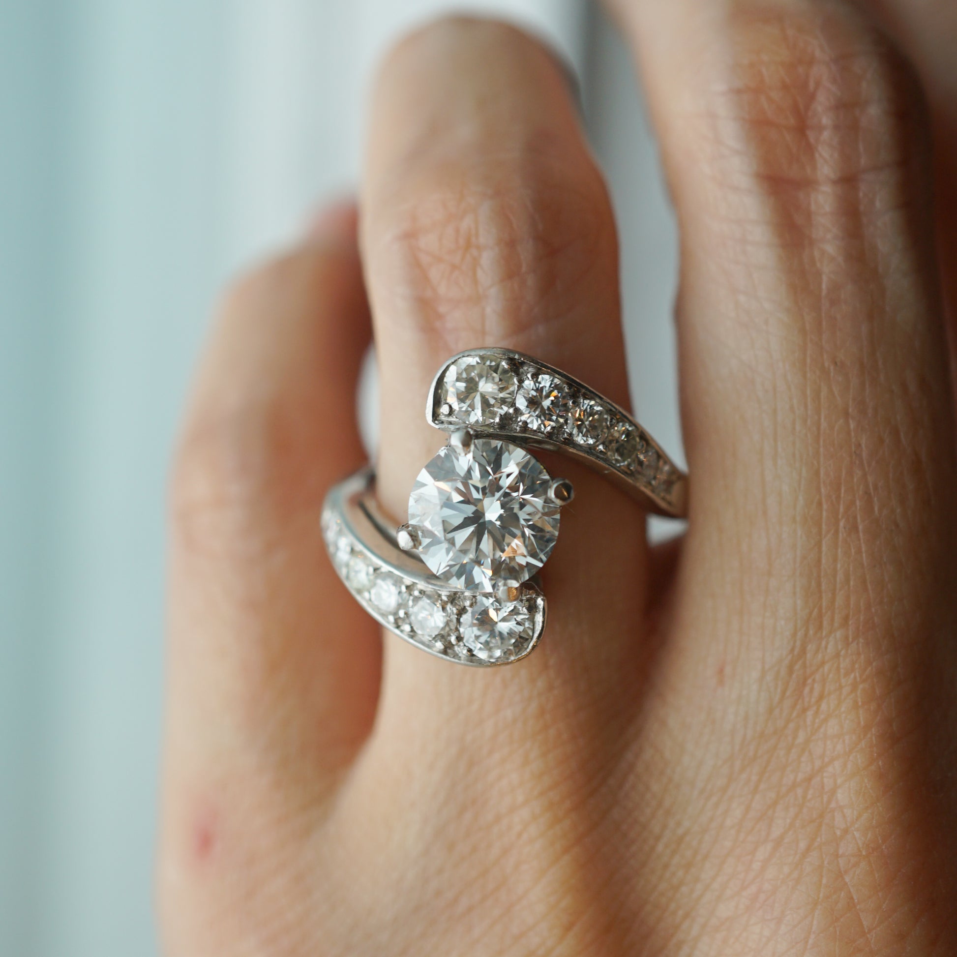 Mid-Century Bypass Diamond Engagement Ring in PlatinumComposition: Platinum Ring Size: 7 Total Diamond Weight: 3.01ct Total Gram Weight: 8.2 g Inscription: 10%
      