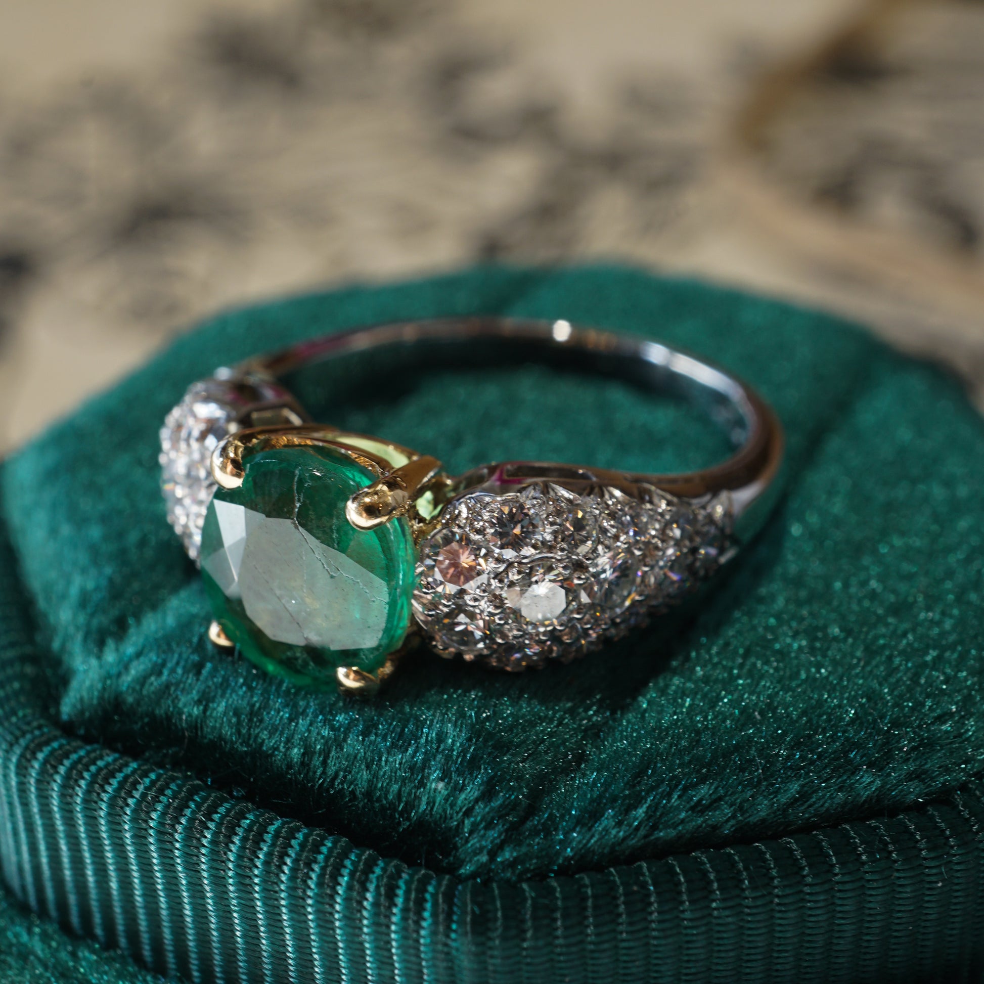 1.39 Oval Cut Emerald & Pave Diamond Ring in Platinum & 14kComposition: Platinum/14 Karat Yellow GoldRing Size: 7.25Total Diamond Weight: .46 ctTotal Gram Weight: 5.8 gInscription: PLAT