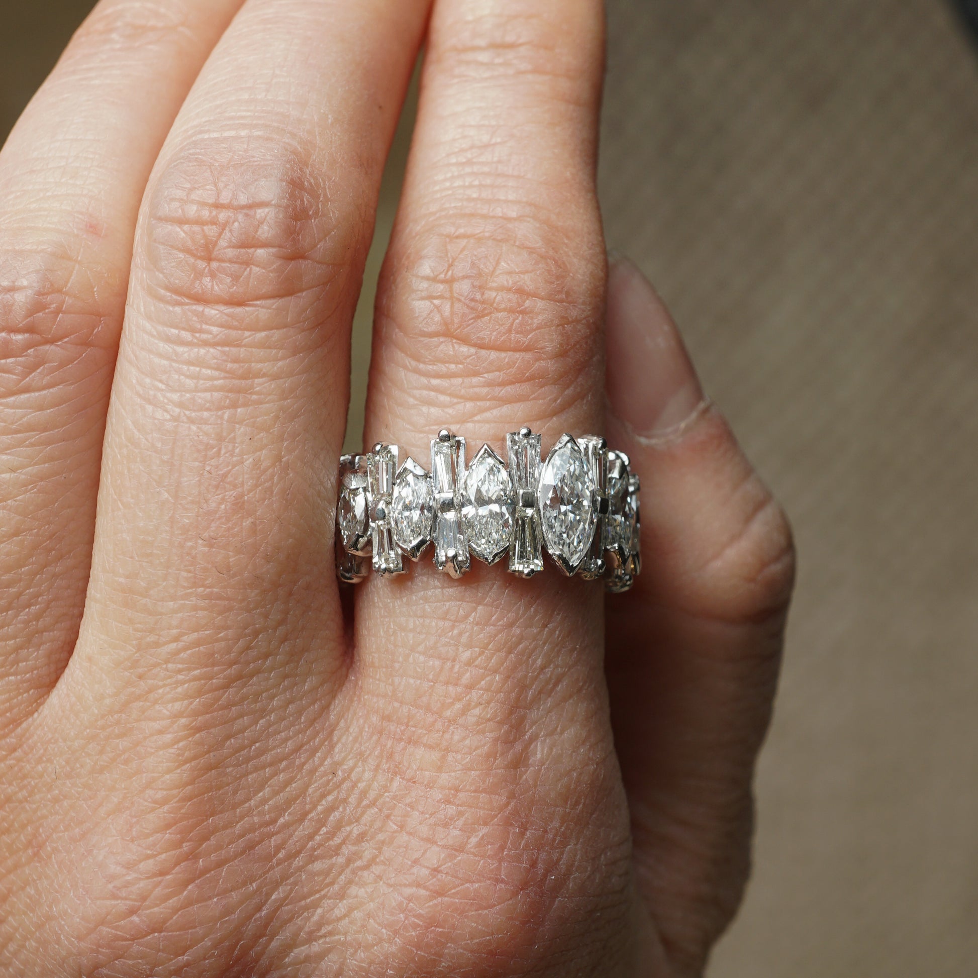 Marquise & Baguette Cut Diamond Eternity Ring in PlatinumComposition: PlatinumRing Size: 7Total Diamond Weight: 5.05 ctTotal Gram Weight: 9.5 g