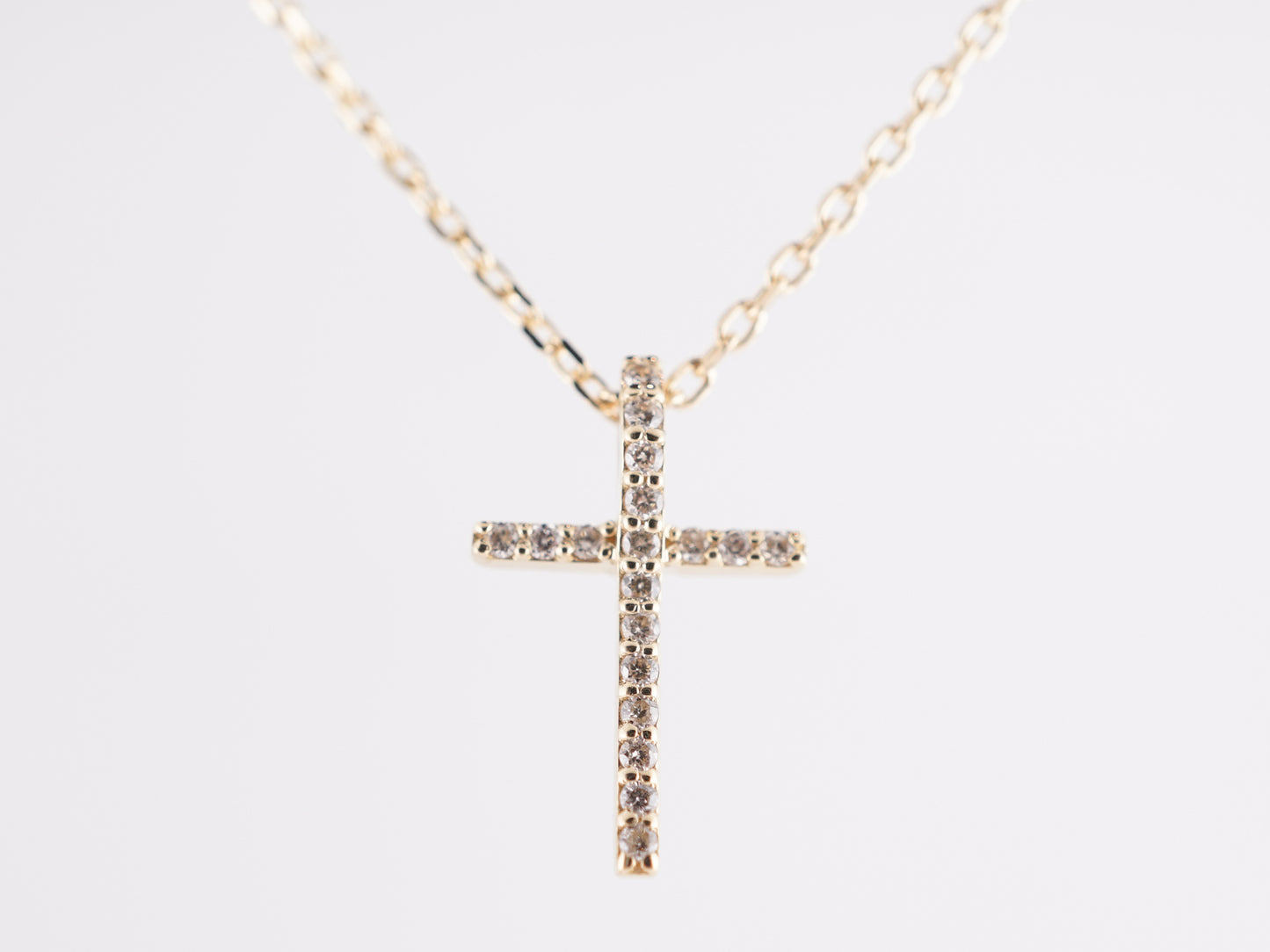 .07 Diamond Cross Necklace in 14k Yellow Gold