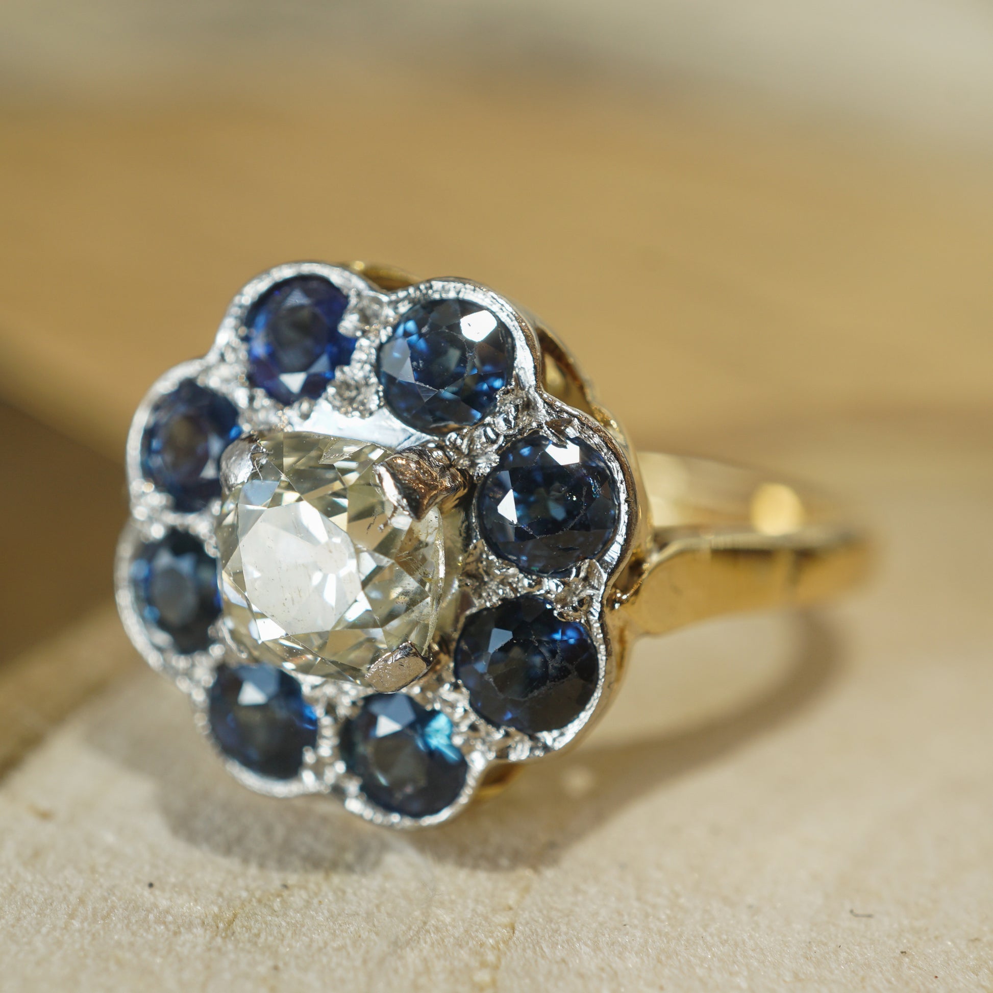 Victorian Sapphire Halo Diamond Engagement Ring in 18k & PlatinumComposition: Platinum/18 Karat Yellow Gold Ring Size: 7.25 Total Diamond Weight: .91ct Total Gram Weight: 5.3 g Inscription: 18CT PLAT
      