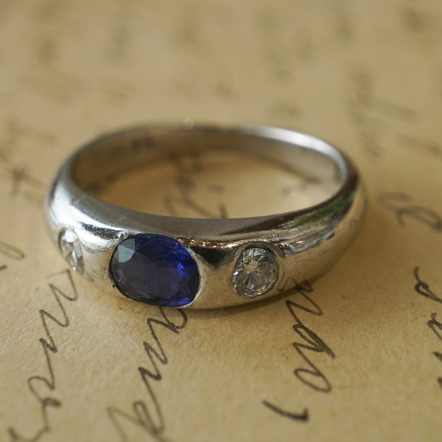 Flush Set Sapphire & Diamond Engagement Ring in Platinum