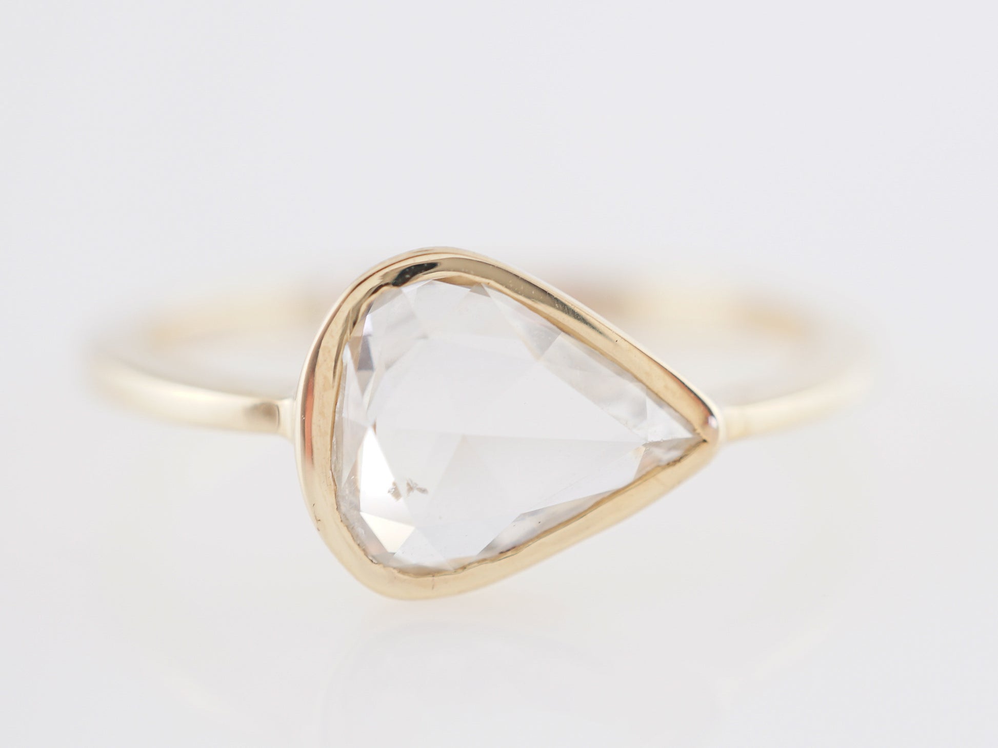 1.14 Pear Shaped Rose Cut Diamond Engagement Ring 14k GoldComposition: 14 Karat Yellow GoldRing Size: 6.5Total Diamond Weight: 1.14 ctTotal Gram Weight: 1.8 gInscription: 14k