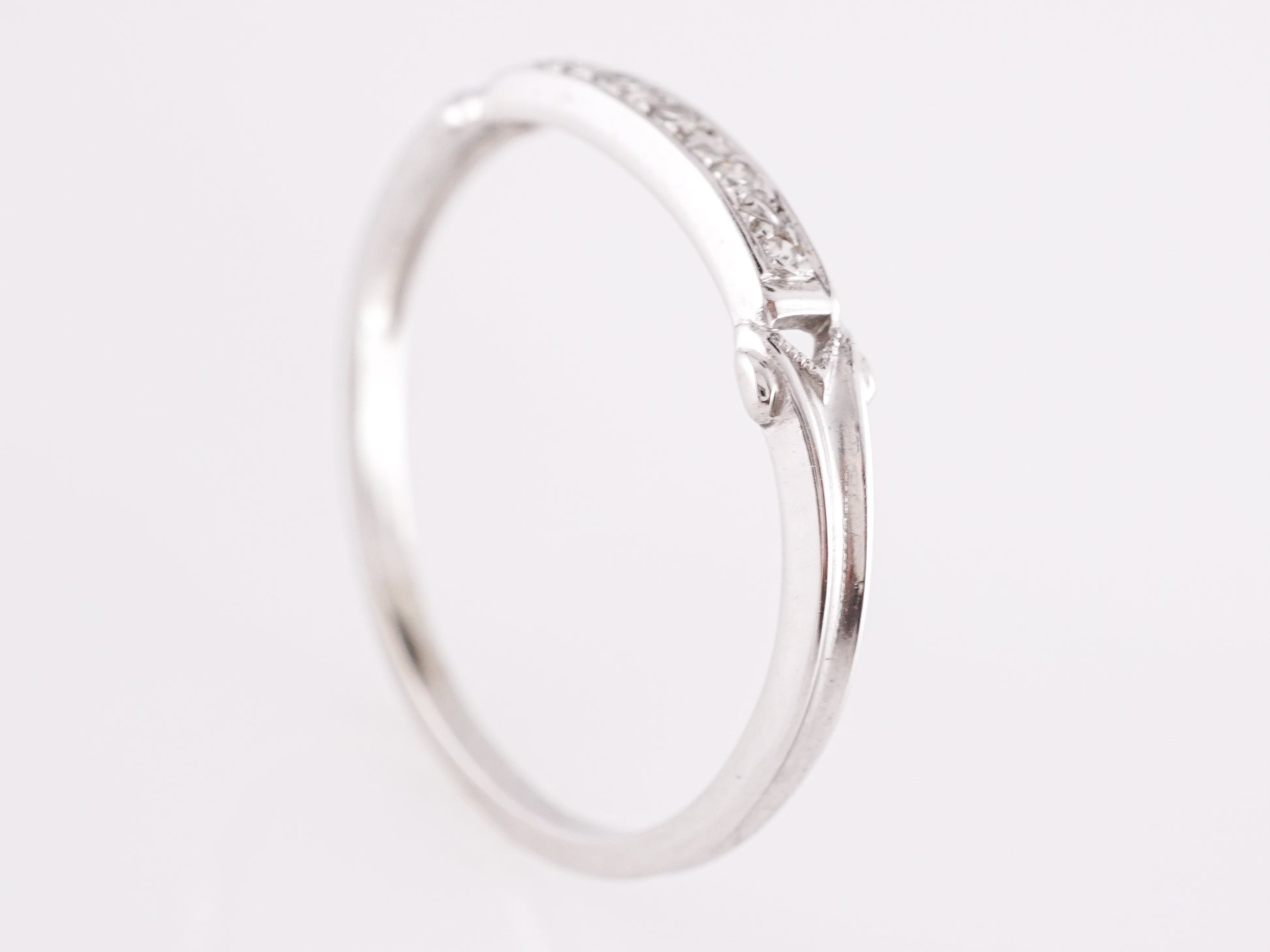 .05 Vintage Deco Diamond Wedding Band in 10k White GoldComposition: Platinum Ring Size: 5.5 Total Diamond Weight: .05ct Total Gram Weight: .70 g Inscription: 10k
      