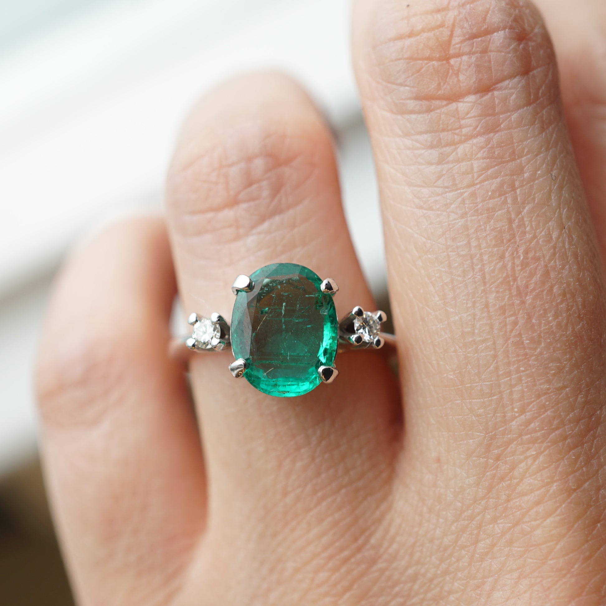 Modern Oval Cut Emerald Ring in 14k White Gold