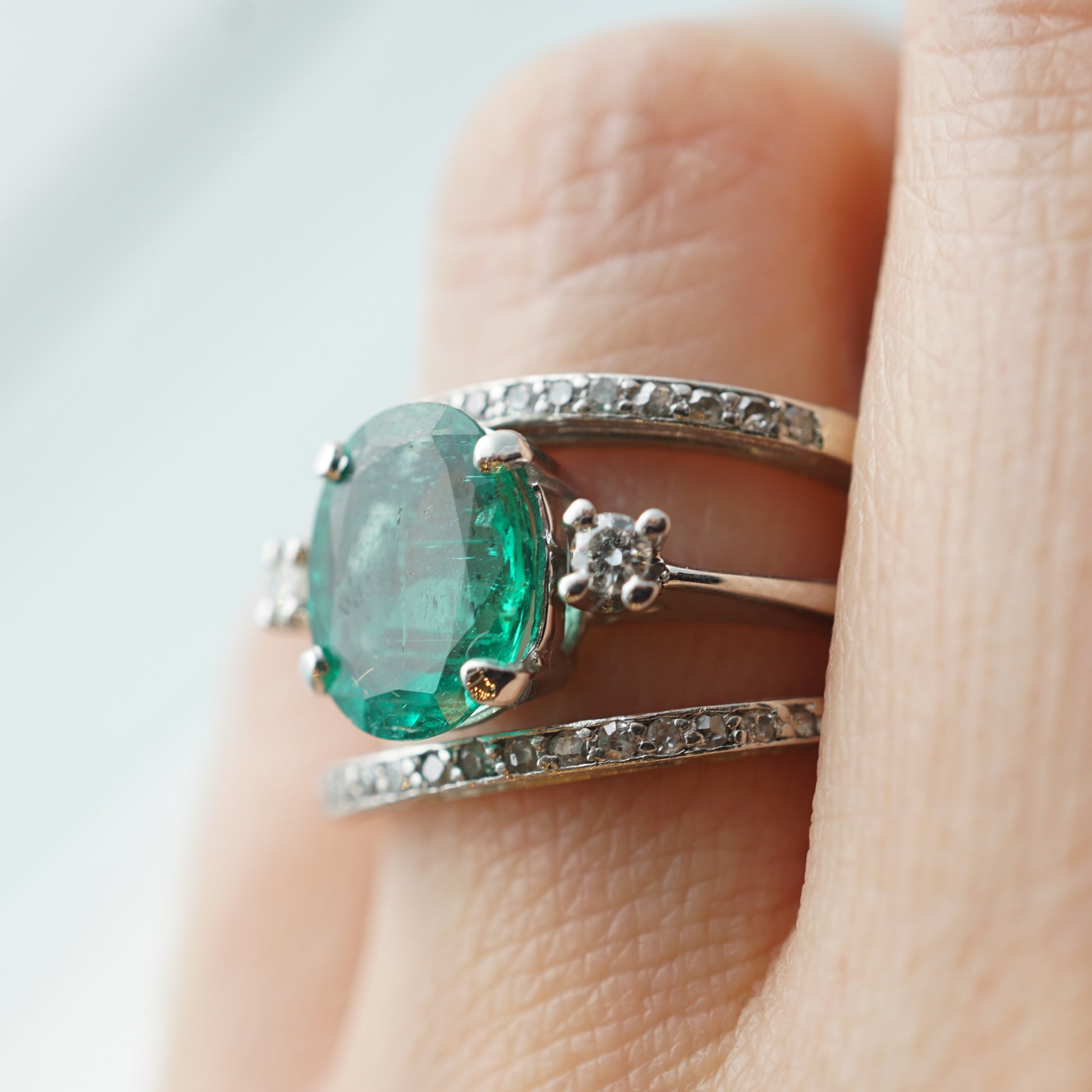 Modern Oval Cut Emerald Ring in 14k White Gold